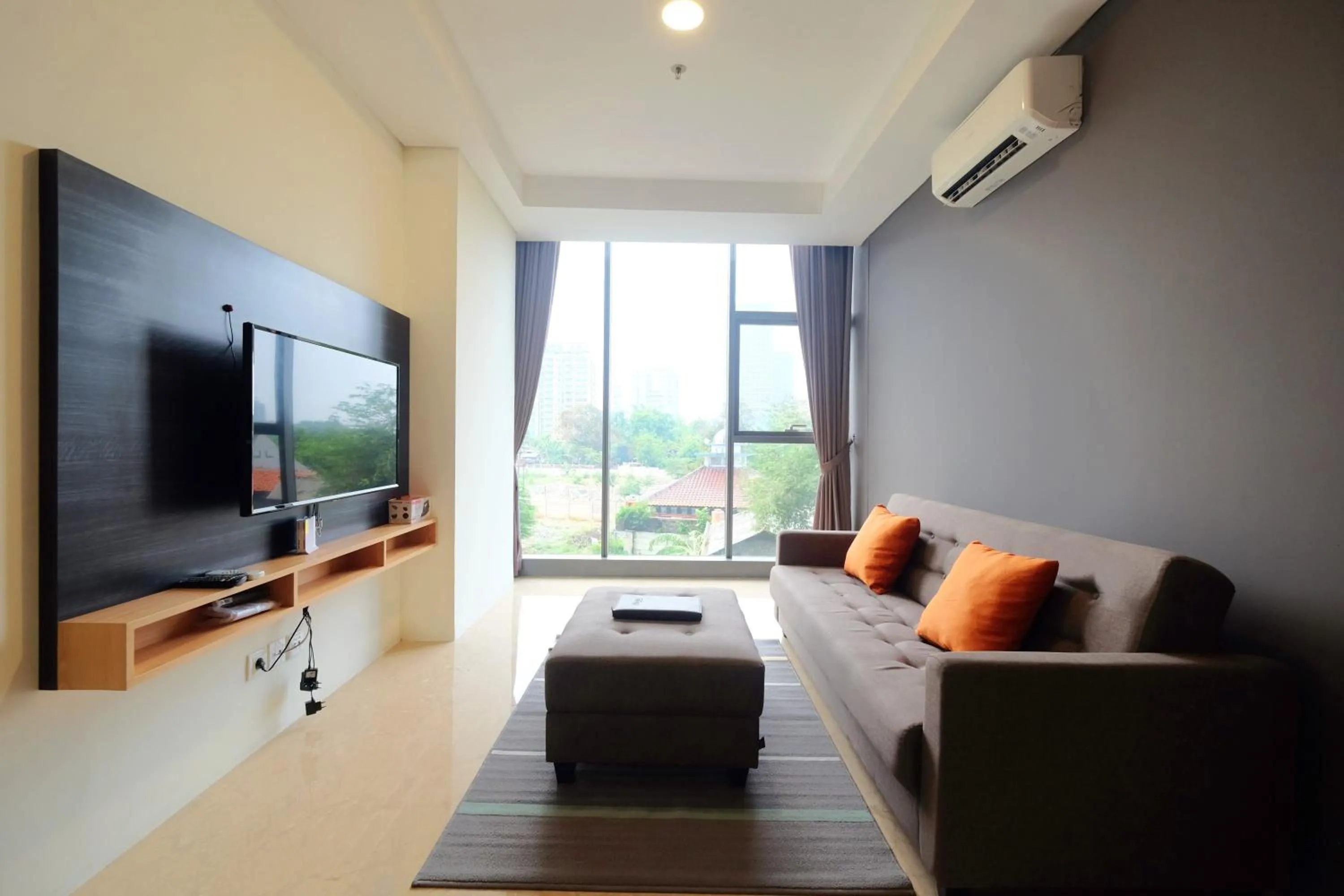 Living room in 2BR Pancoran L'Avenue Apartment Great Facility By Travelio