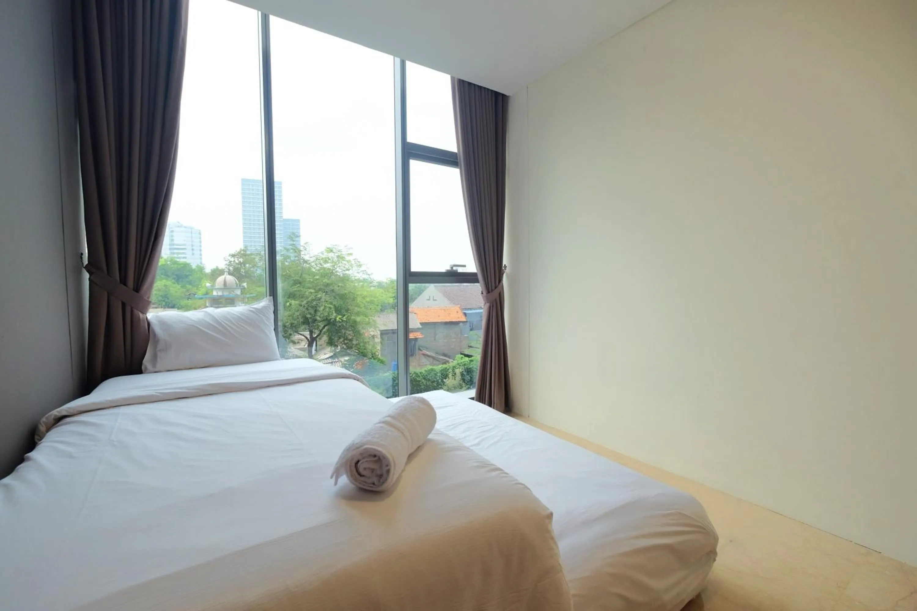 Bed in 2BR Pancoran L'Avenue Apartment Great Facility By Travelio