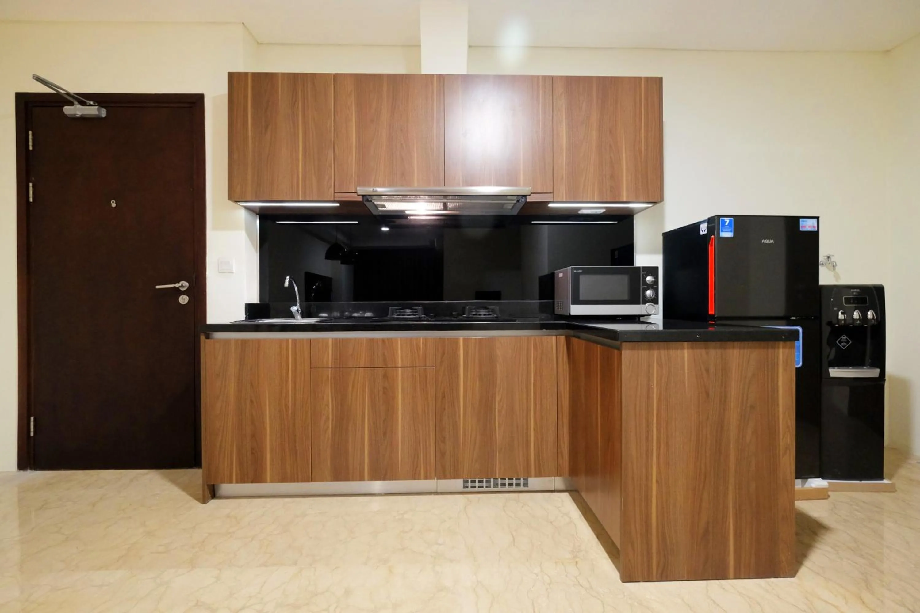 Kitchen or kitchenette in 2BR Pancoran L'Avenue Apartment Great Facility By Travelio