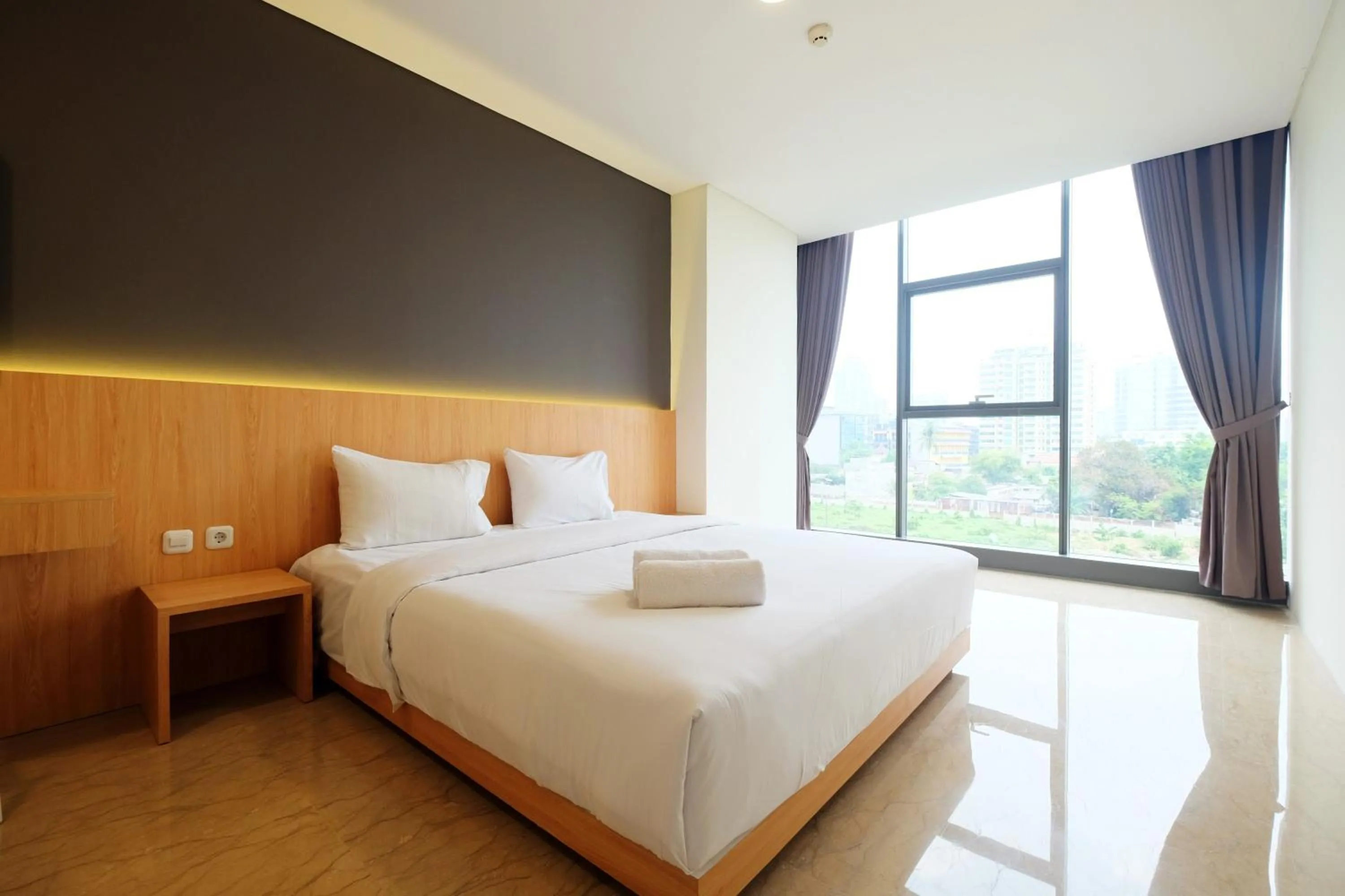 Bed in 2BR Pancoran L'Avenue Apartment Great Facility By Travelio
