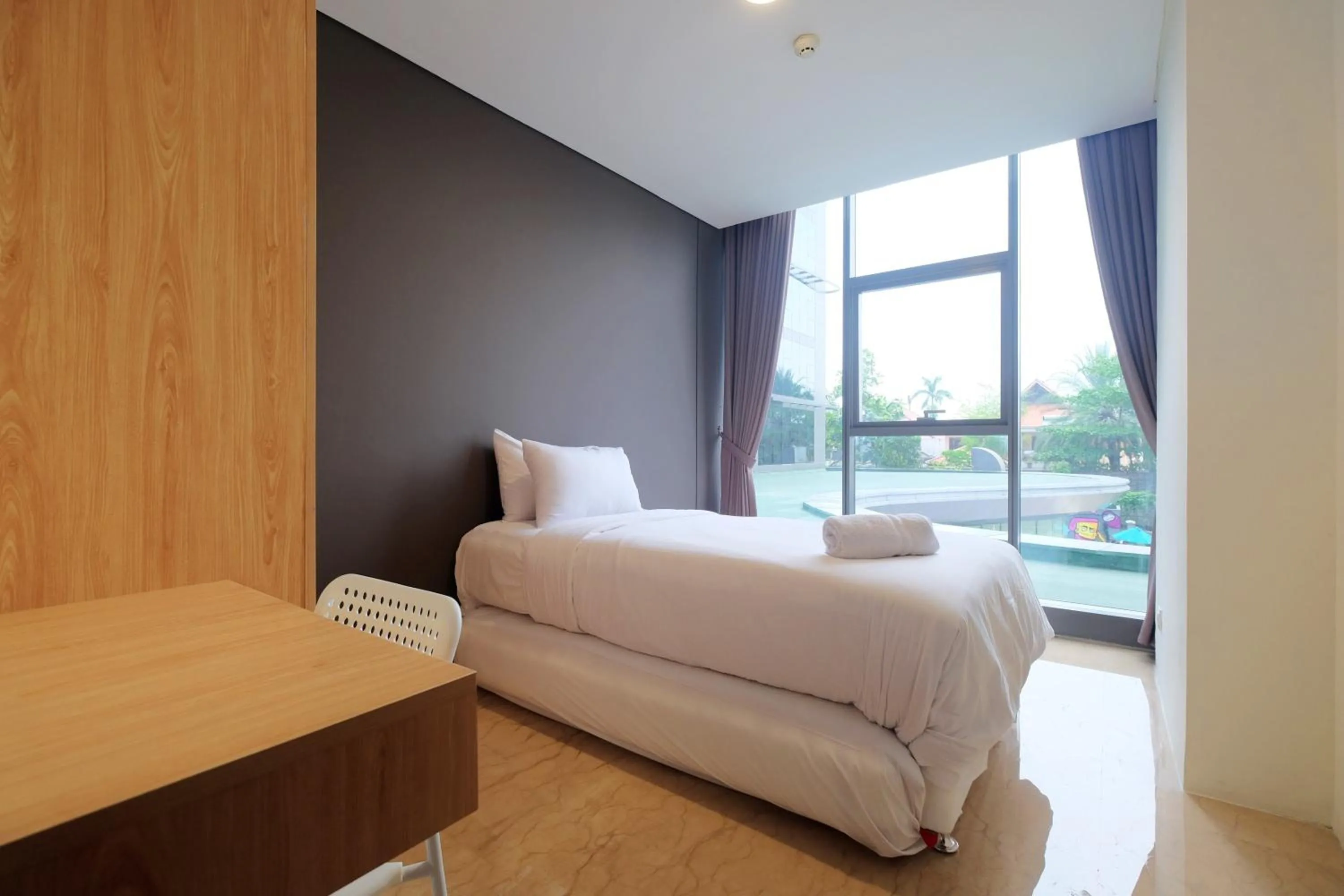 Bed in 2BR Pancoran L'Avenue Apartment Great Facility By Travelio