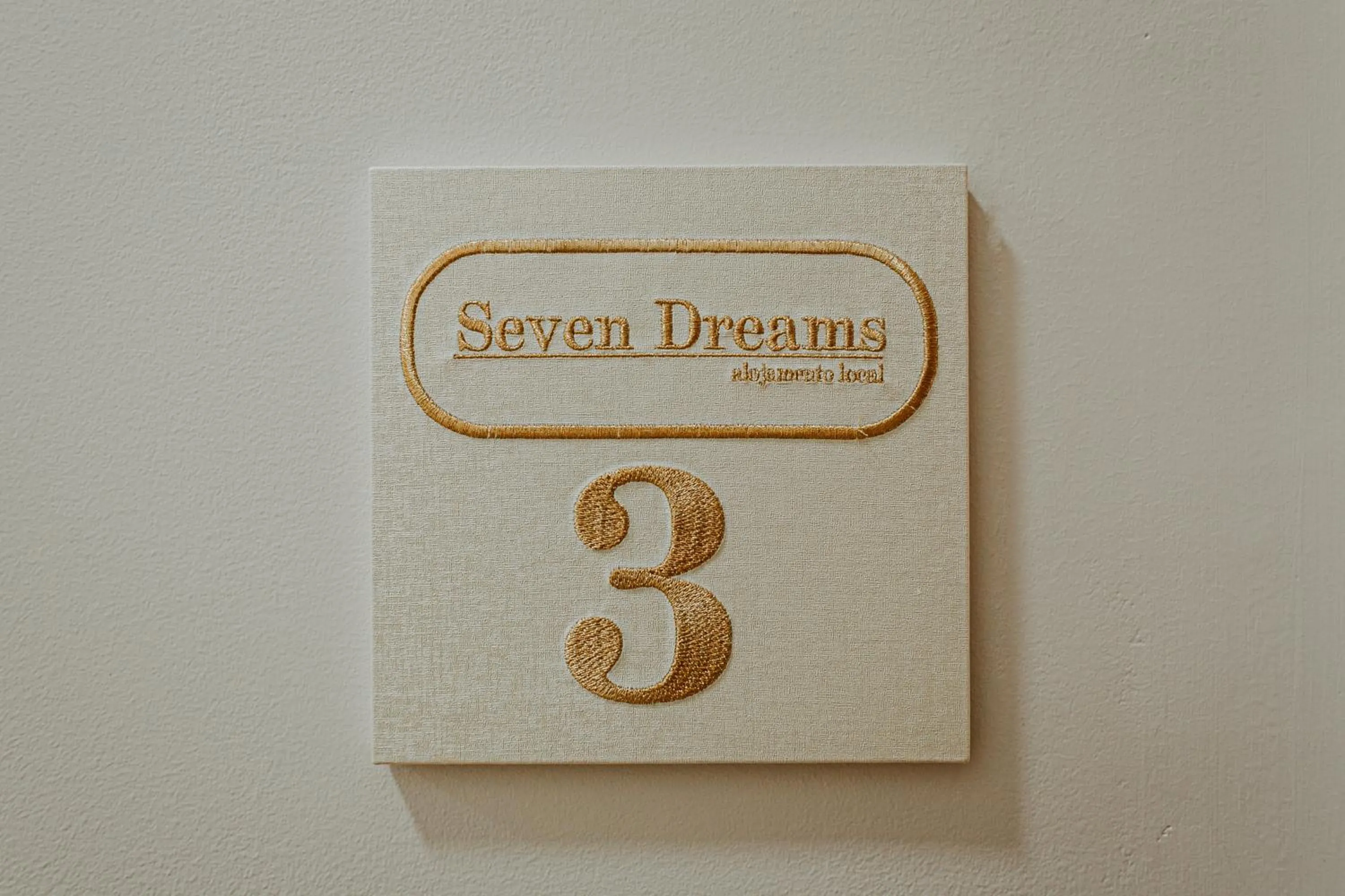 Property logo or sign in Seven Dreams Suites