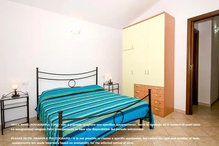 Bed in Appartamenti Tanaunella