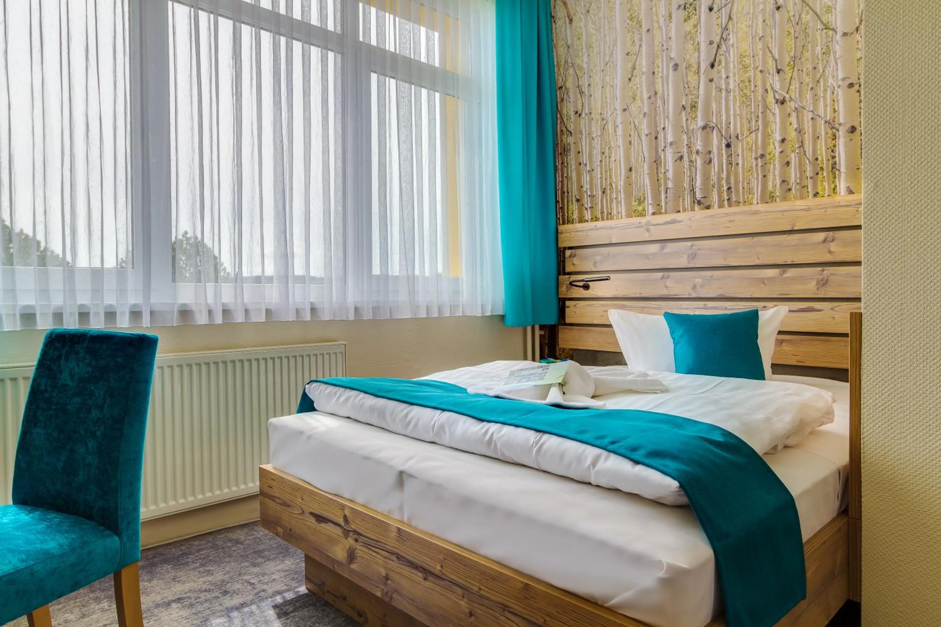 Photo of the whole room, Bed in Panorama Ferien Hotel Harz