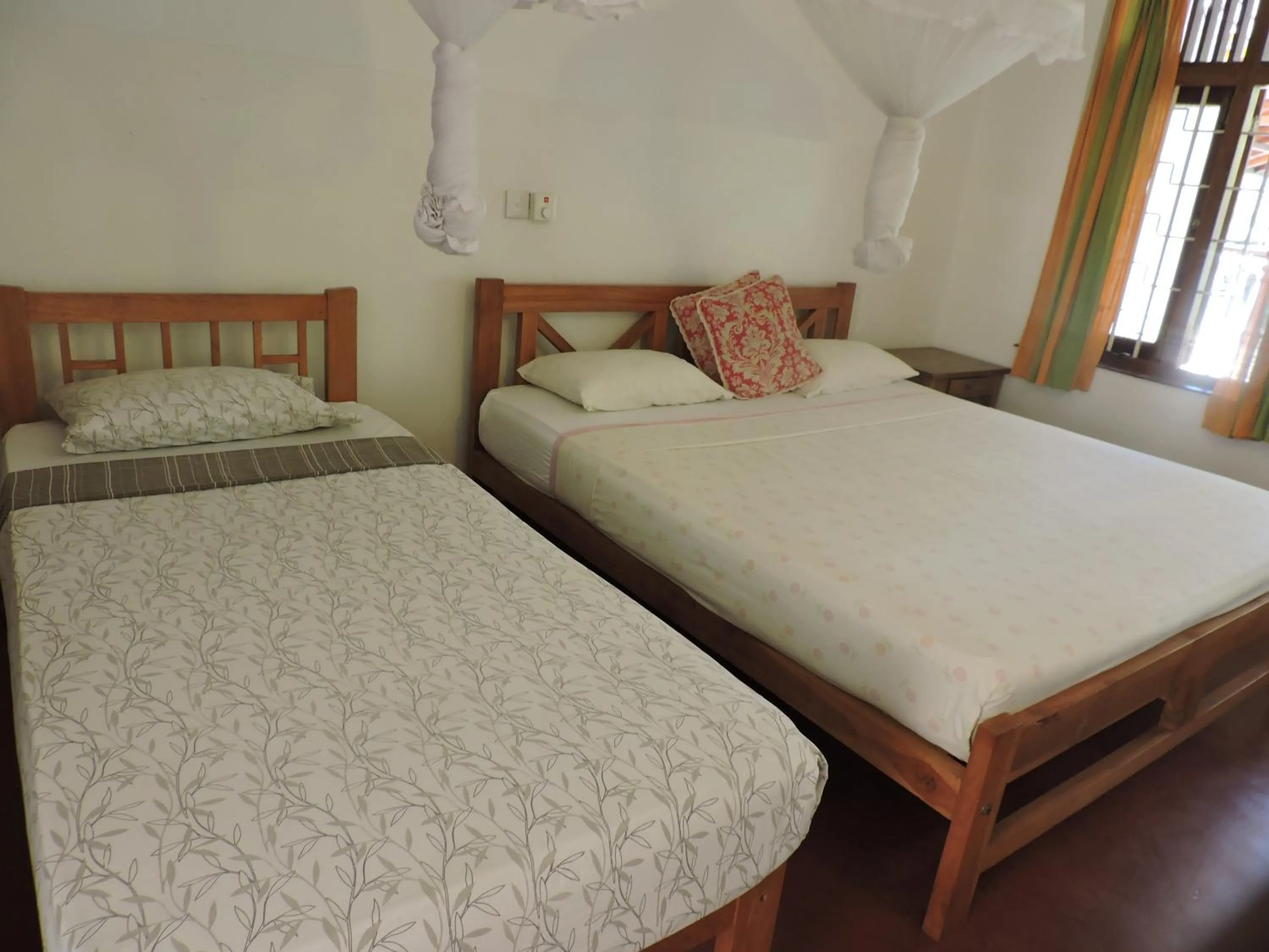 Bed in Hotel Mango Garden