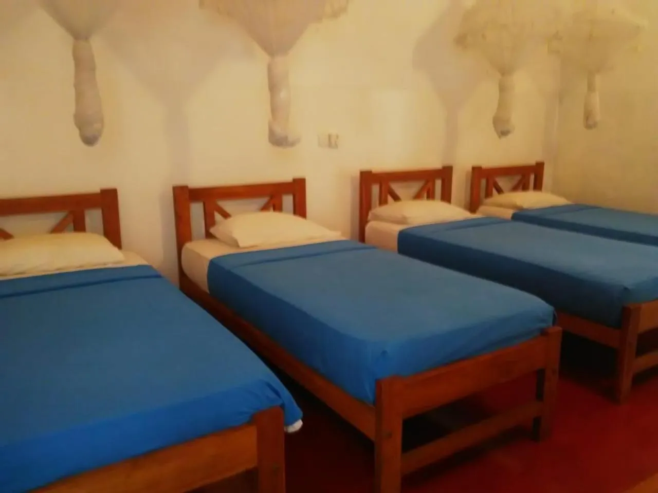 Bed in Hotel Mango Garden