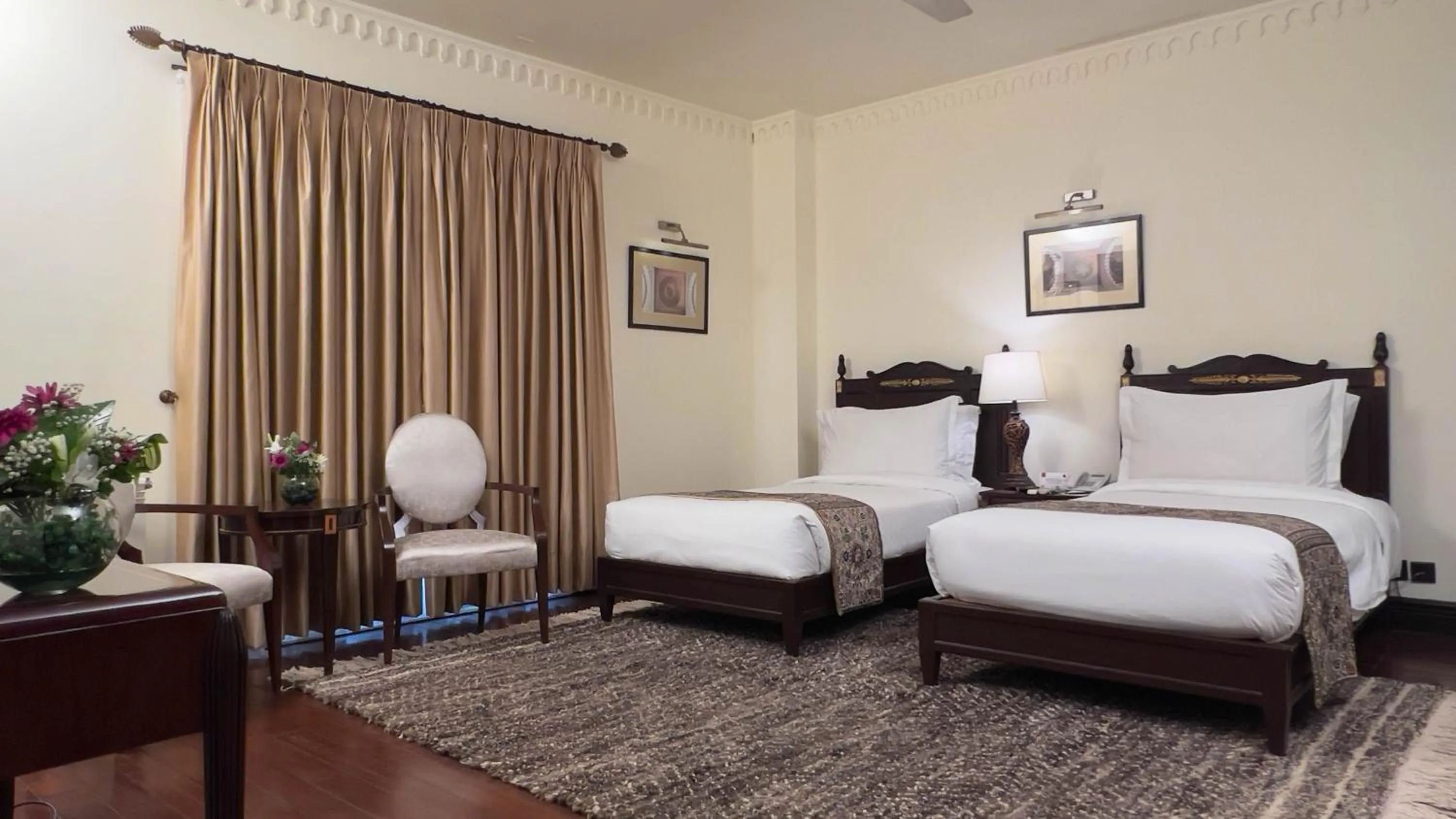 Bed in Heritage Luxury Suites All Suite Hotel