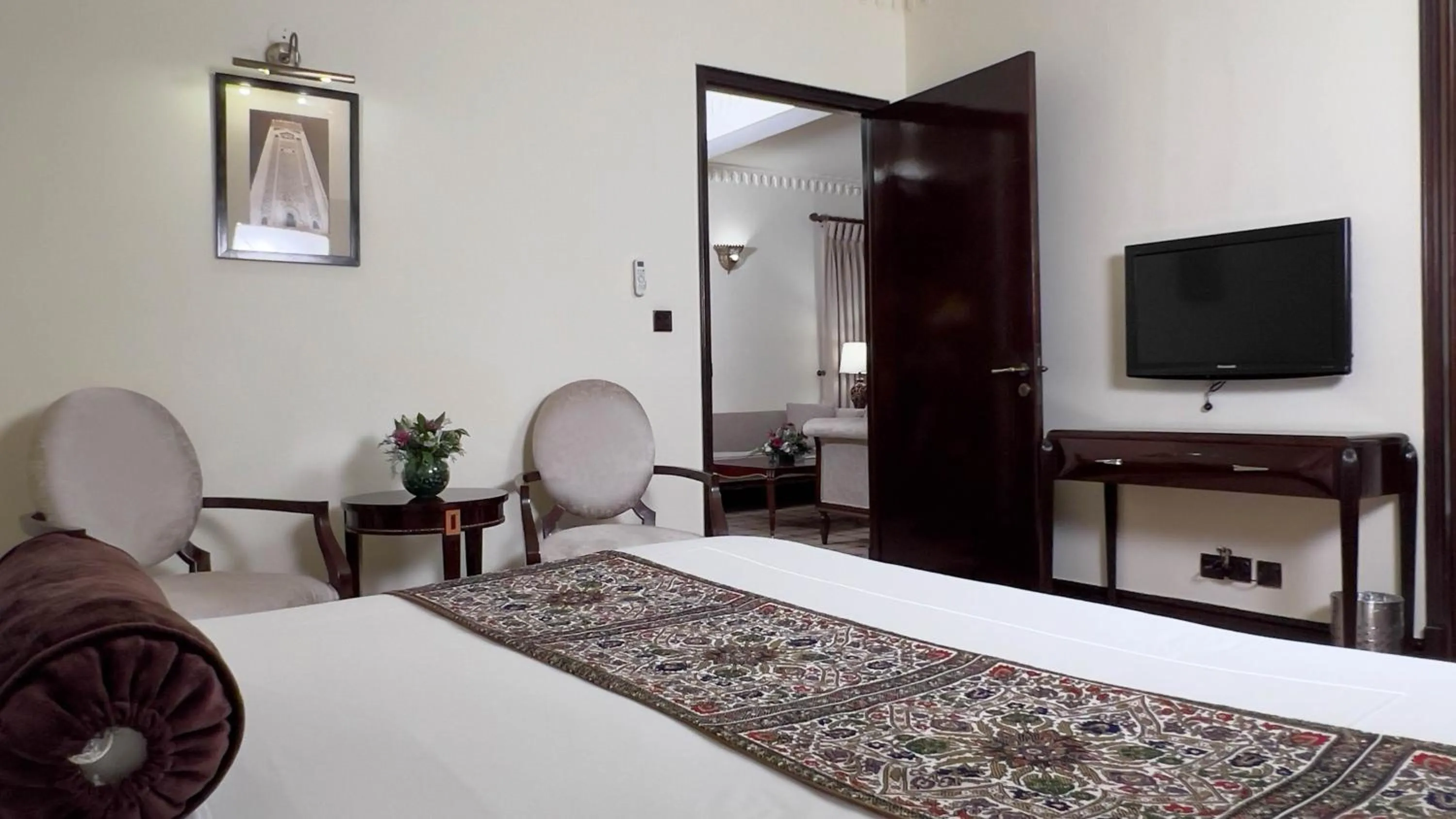 Bed in Heritage Luxury Suites All Suite Hotel