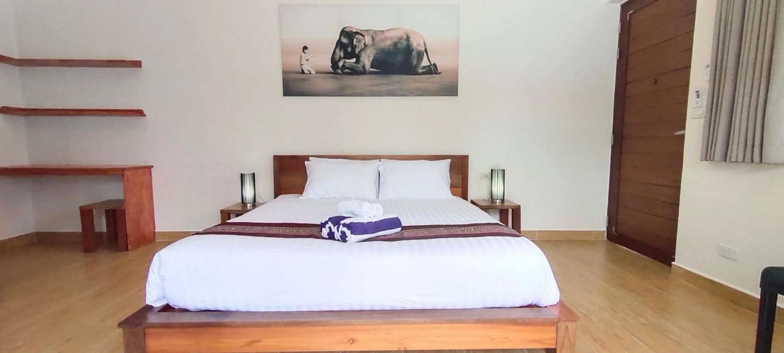 Bed in Le Grand Bleu Hotel