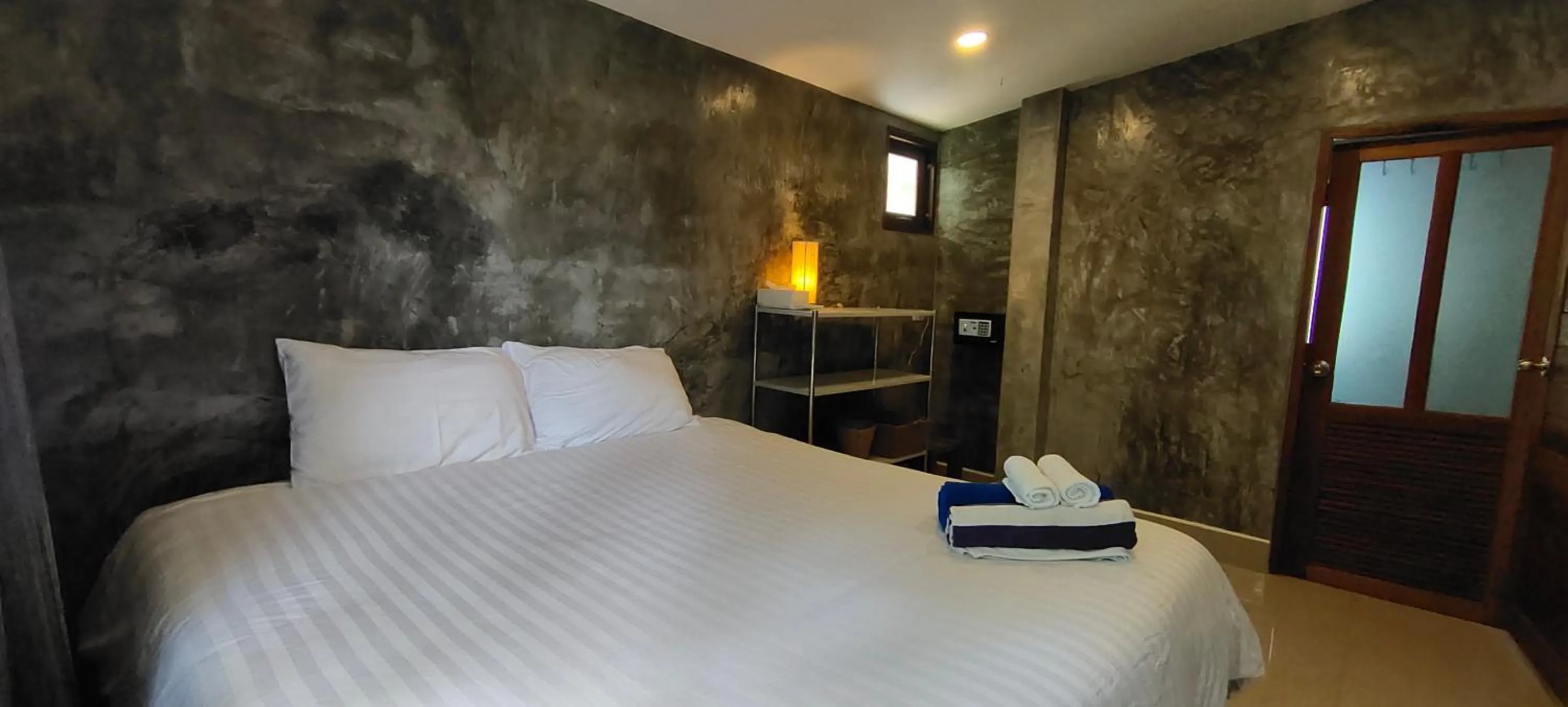 Bed in Le Grand Bleu Hotel