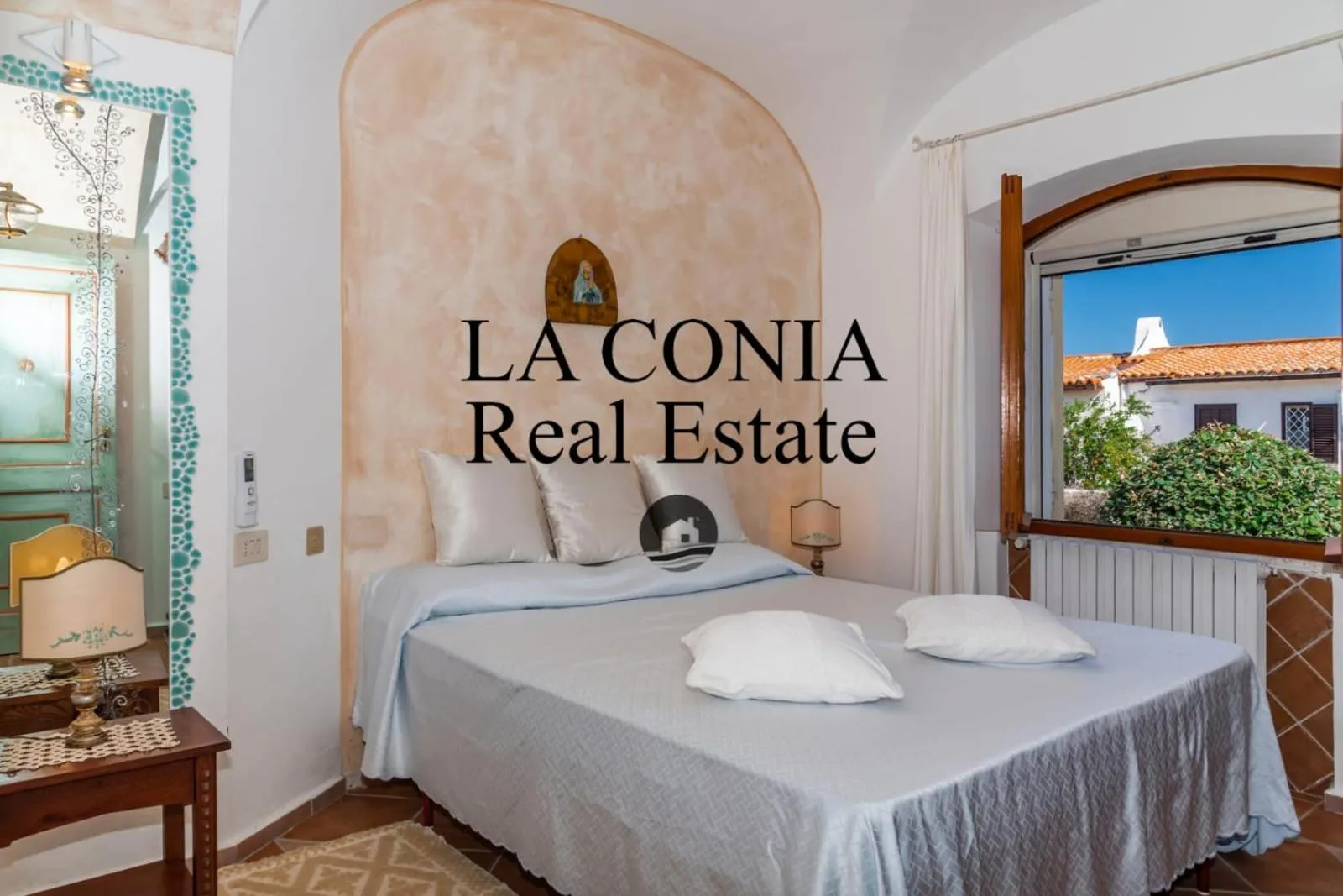 Bed in blue sea villa