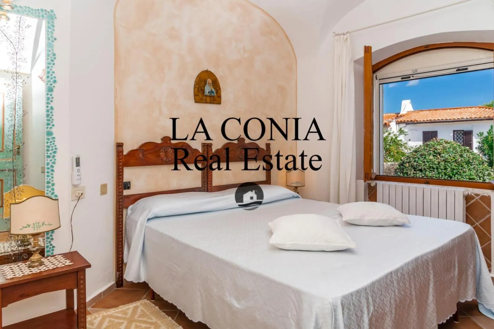 Bed in blue sea villa