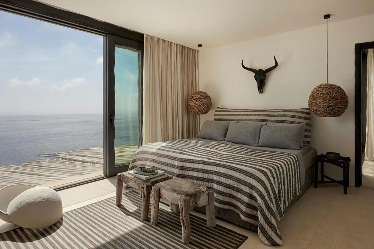 Bed in Myconian Panoptis Escape, a member of Small Luxury Hotels of the World