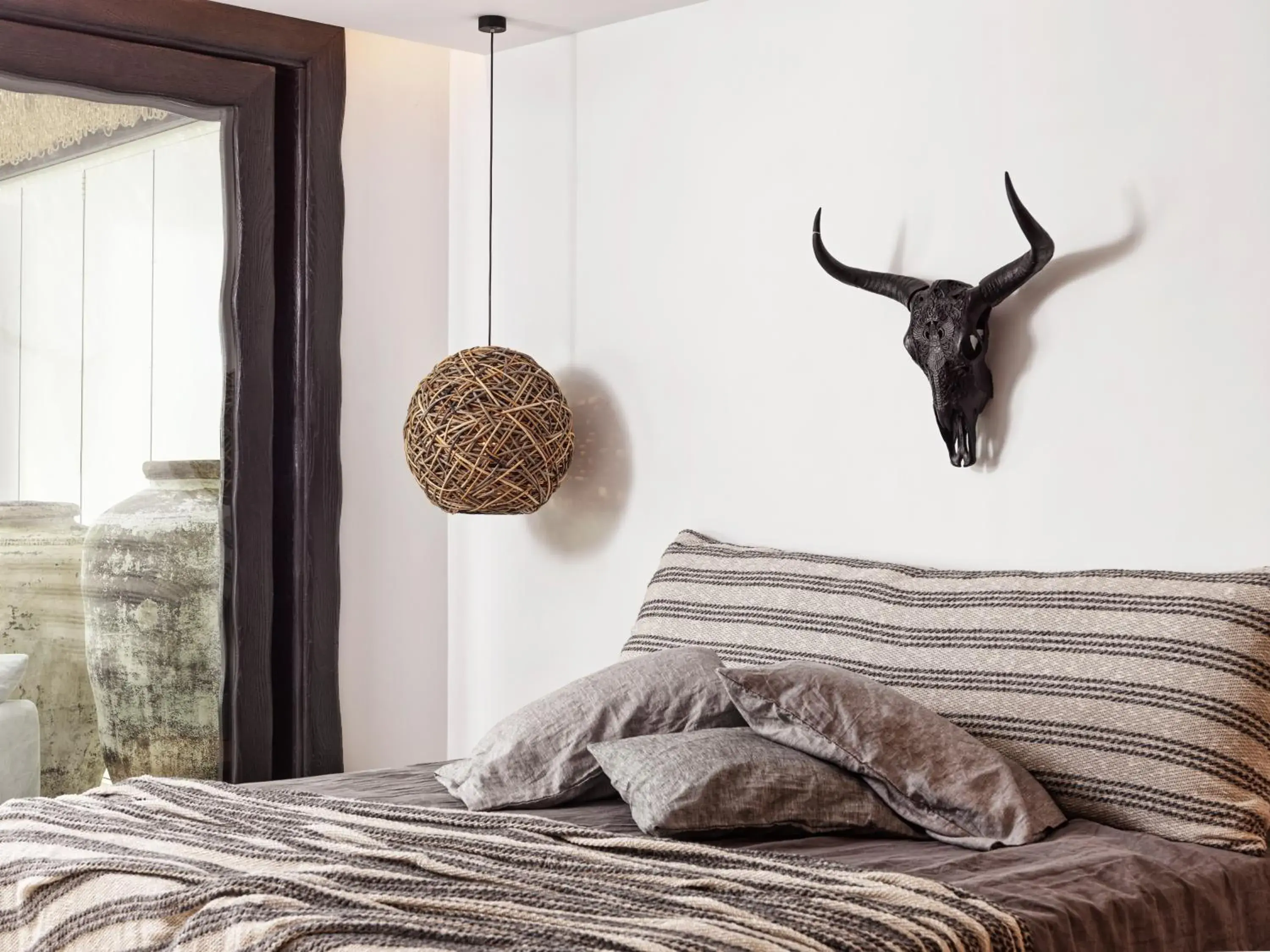 Bed in Myconian Panoptis Escape, a member of Small Luxury Hotels of the World Bed in Myconian Panoptis Escape, a member of Small Luxury Hotels of the World