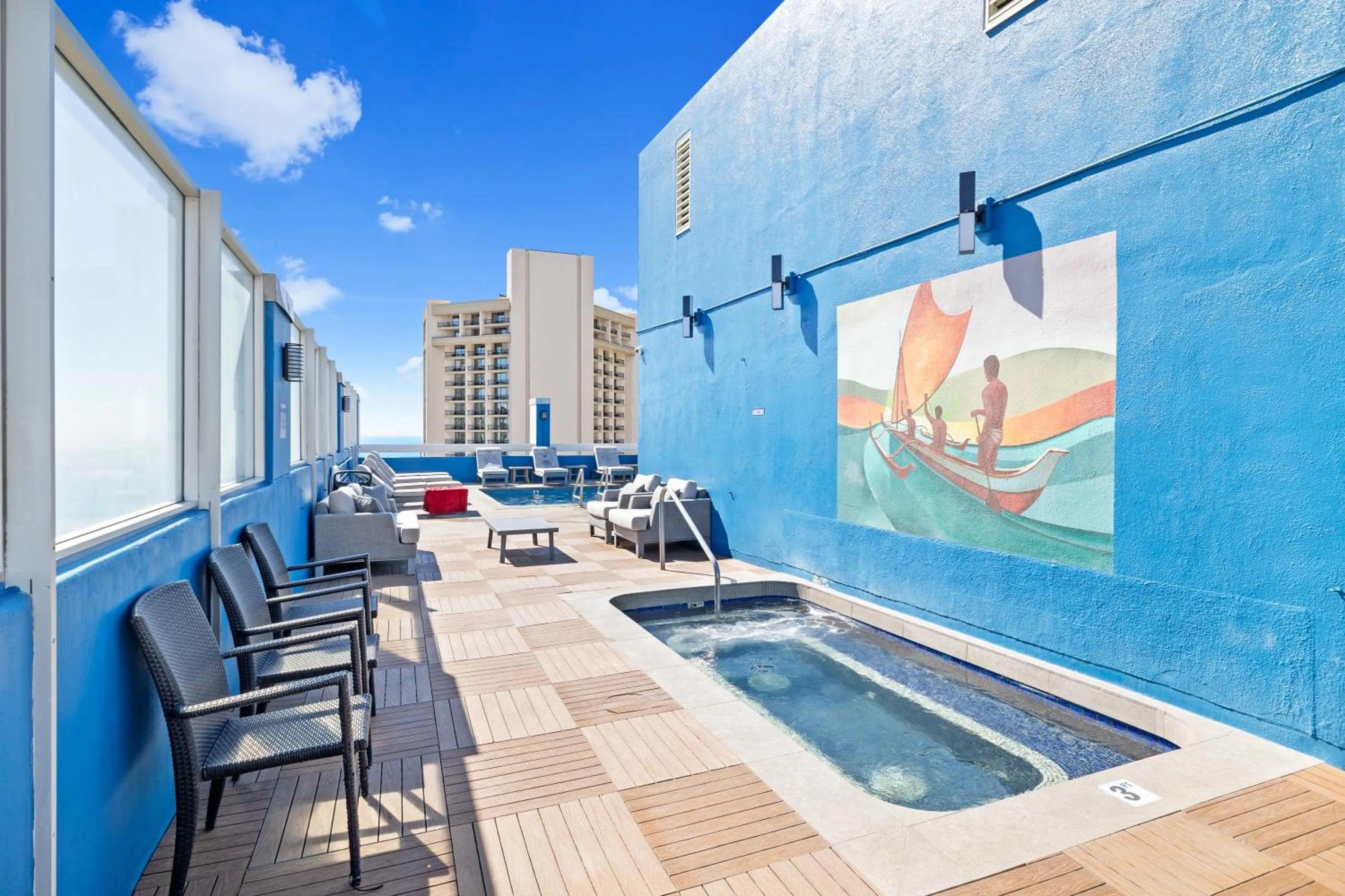 Seating area in Steps to Waikiki Beach! Newly Renovated with 75" TV