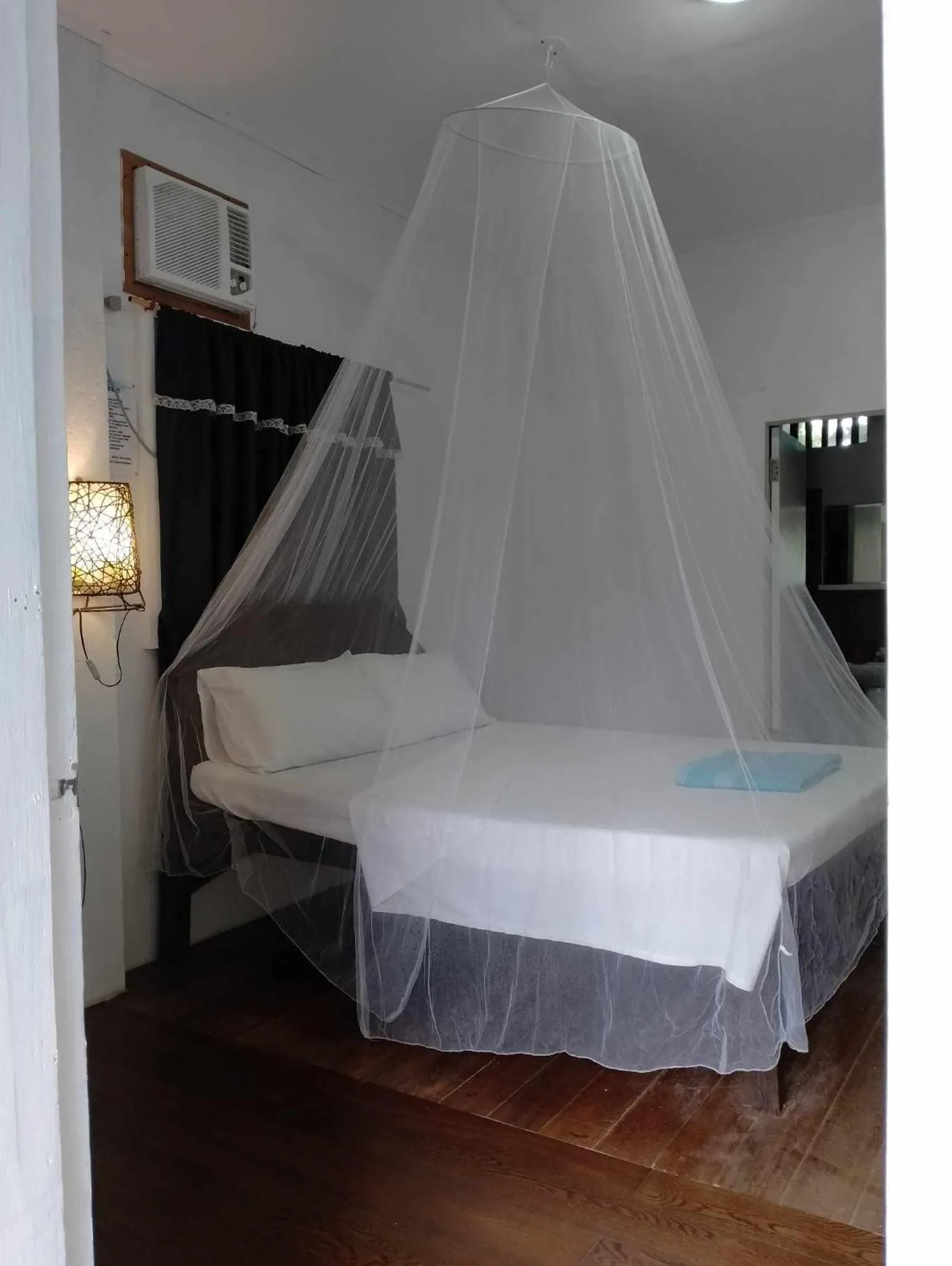 Bed in The Shark's Tail Dive Resort