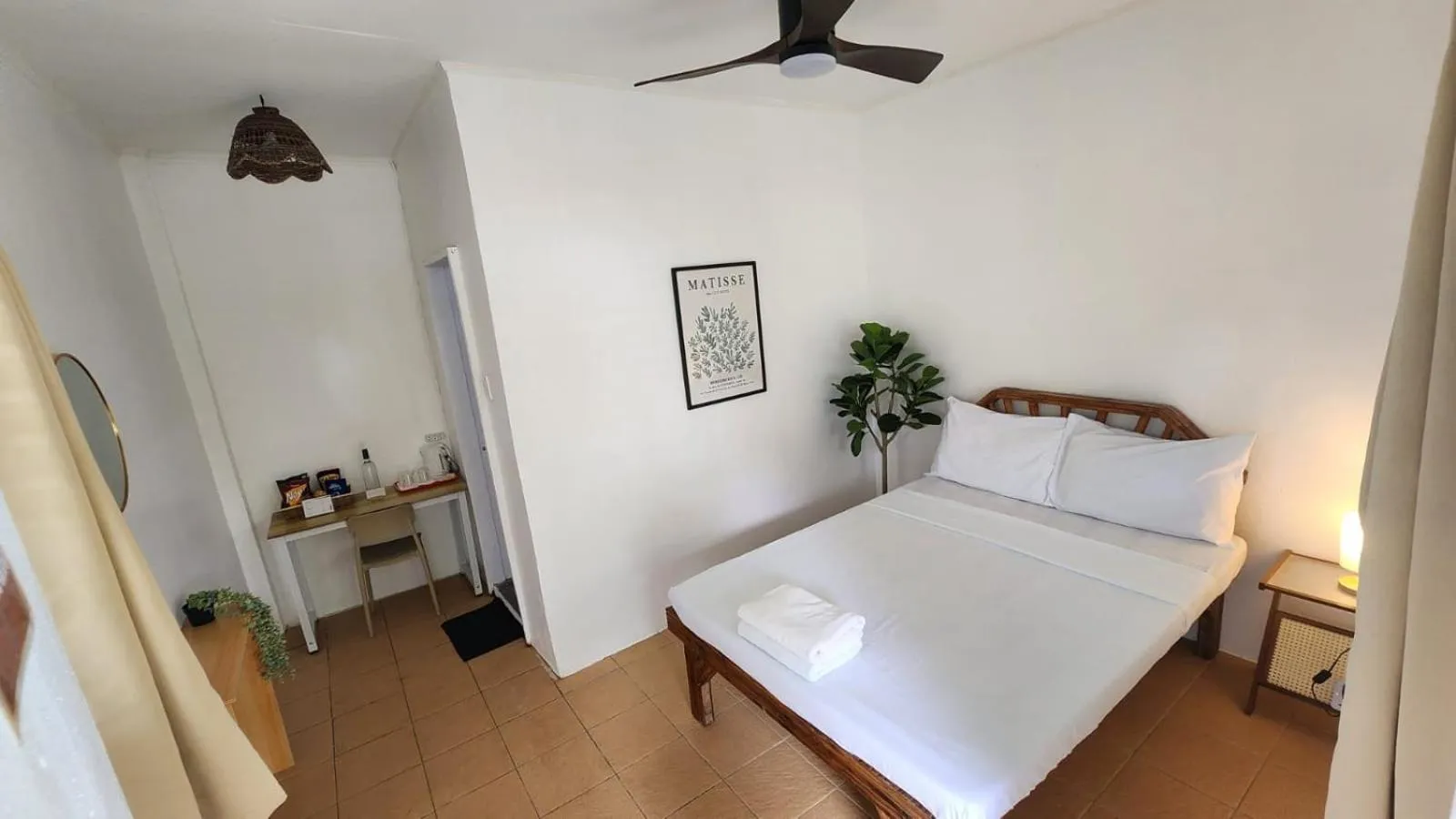 Bed in The Shark's Tail Dive Resort