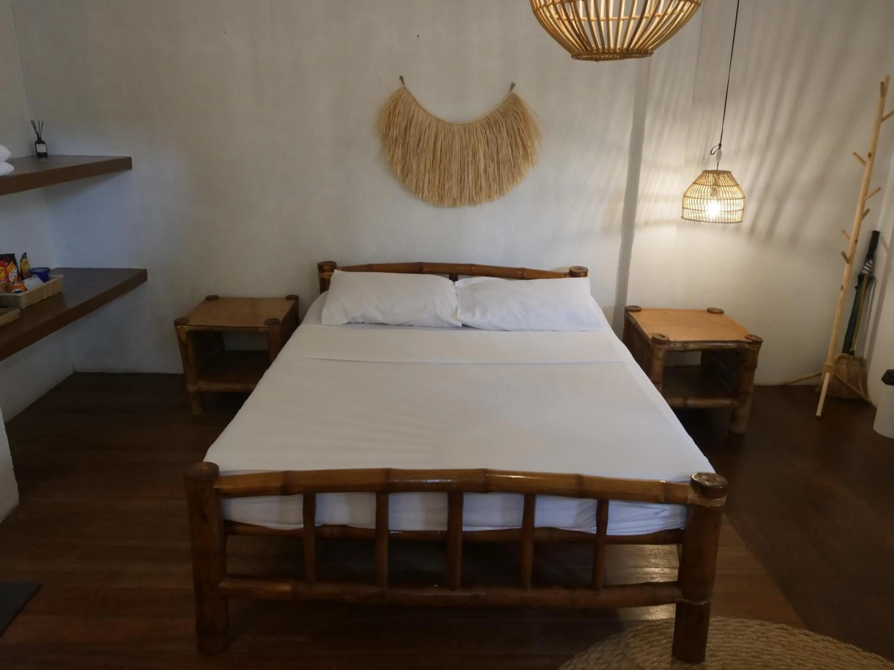 Bed in The Shark's Tail Dive Resort