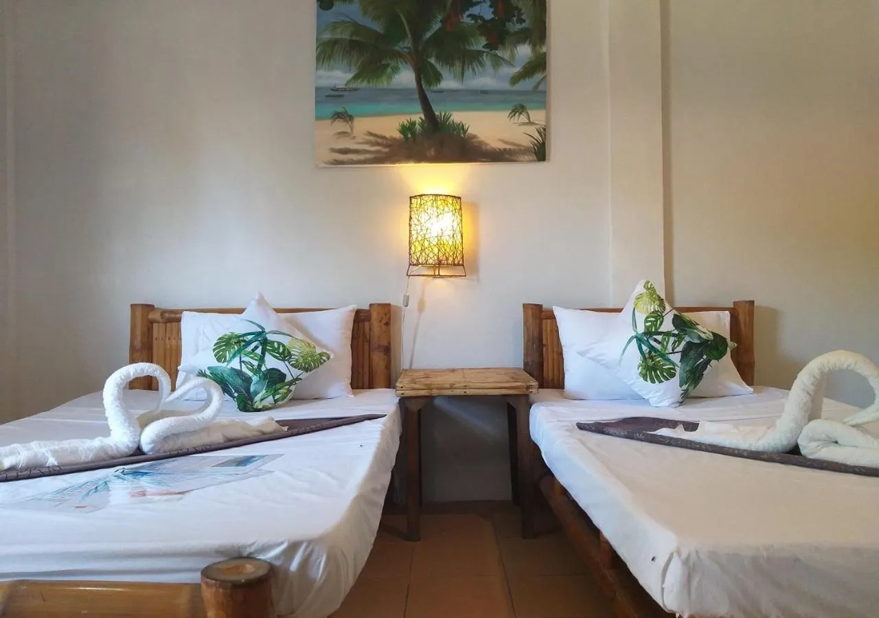 Bed in The Shark's Tail Dive Resort