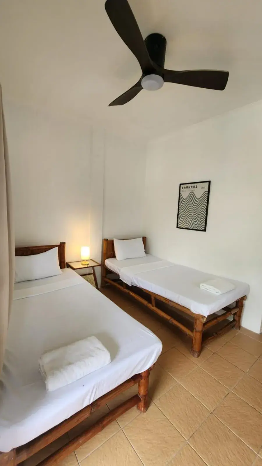 Bed in The Shark's Tail Dive Resort Bed in The Shark's Tail Dive Resort