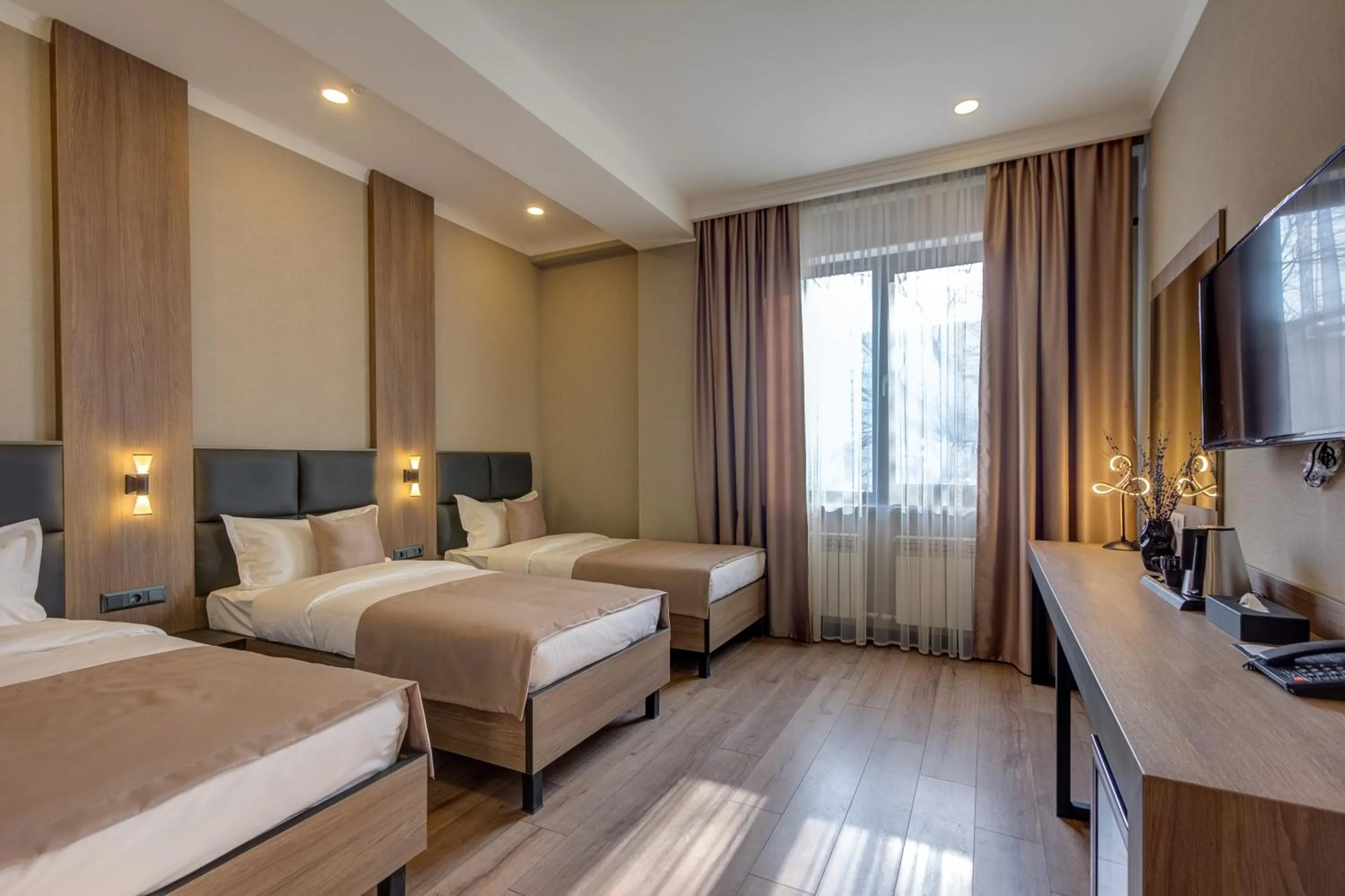 Bed in Sara Hotel Bishkek