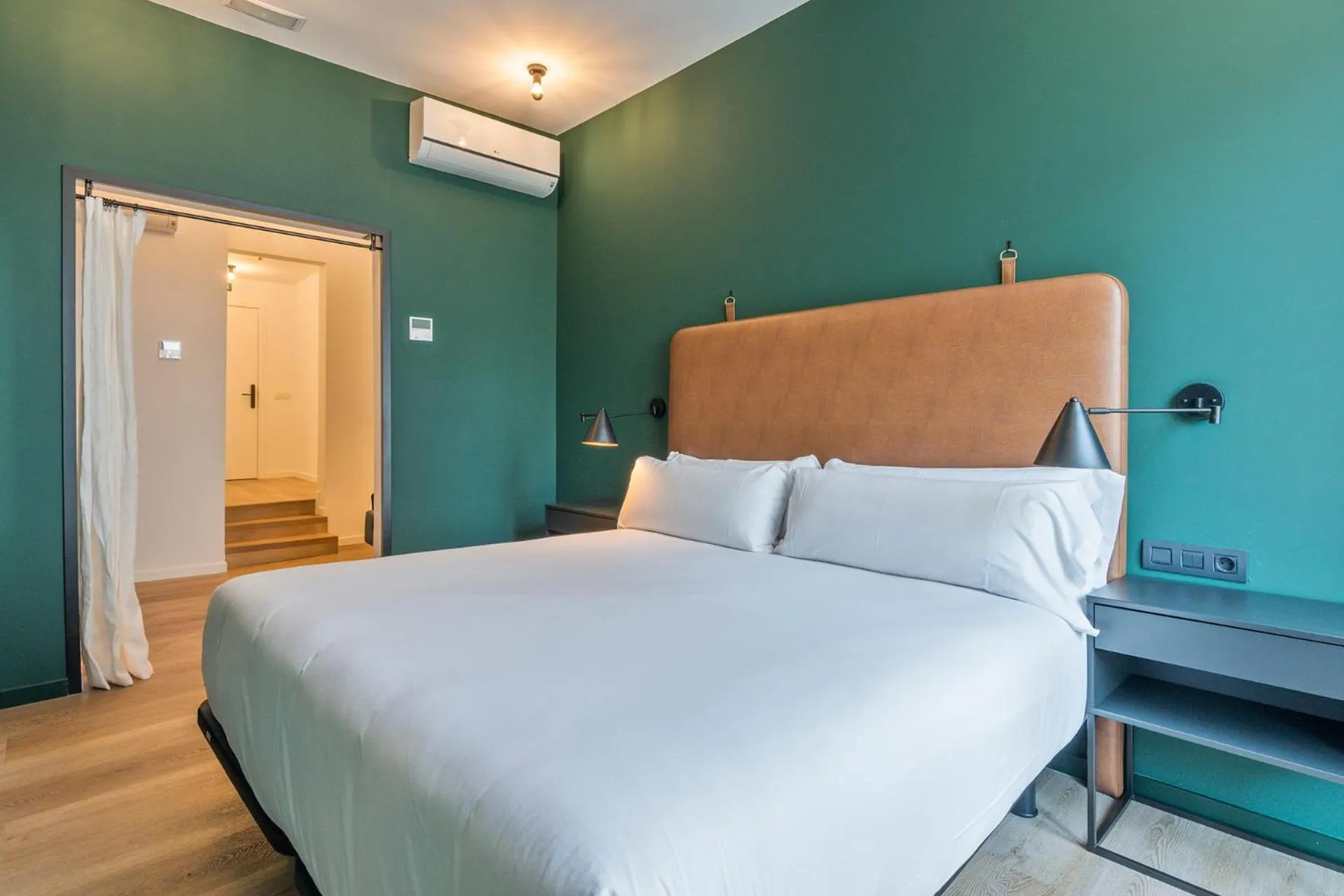 Bed in Uma Suites Atocha