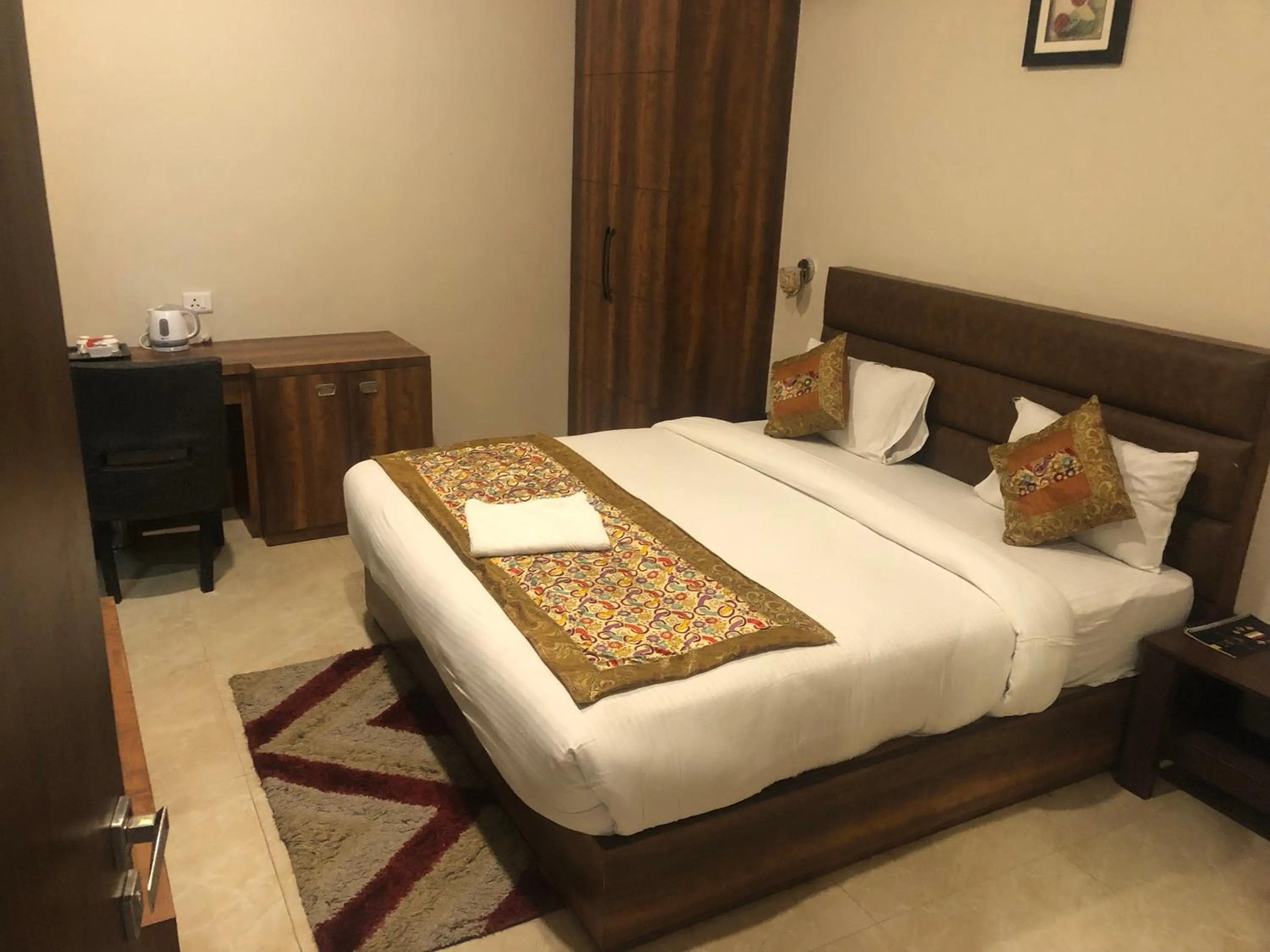 Bed in Hotel Radiance Courtyard