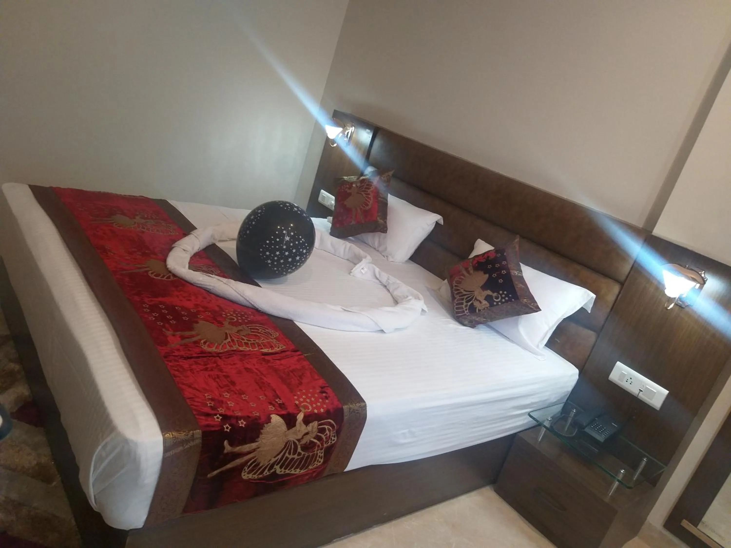 Bed in Hotel Radiance Courtyard