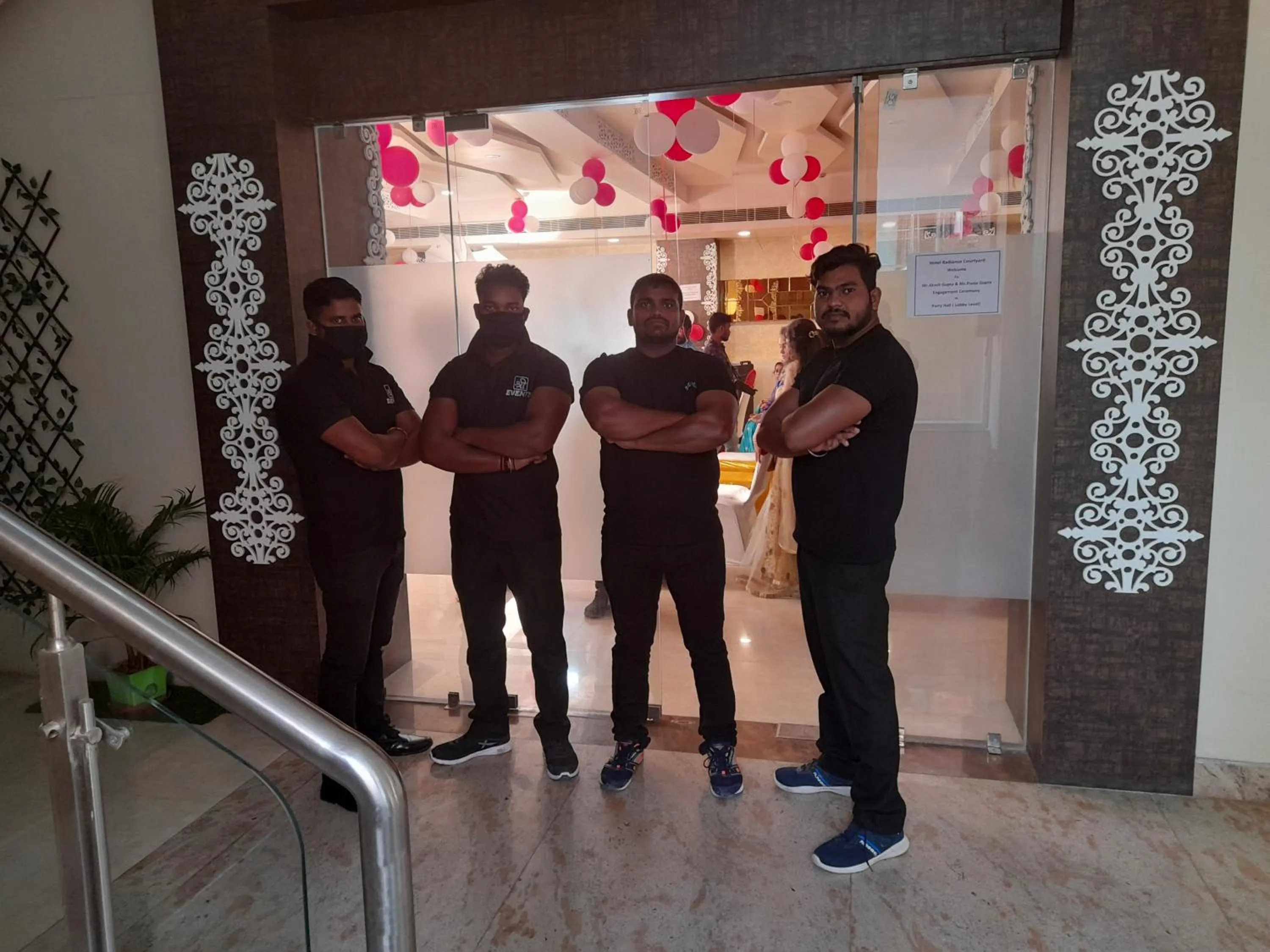 Staff in Hotel Radiance Courtyard