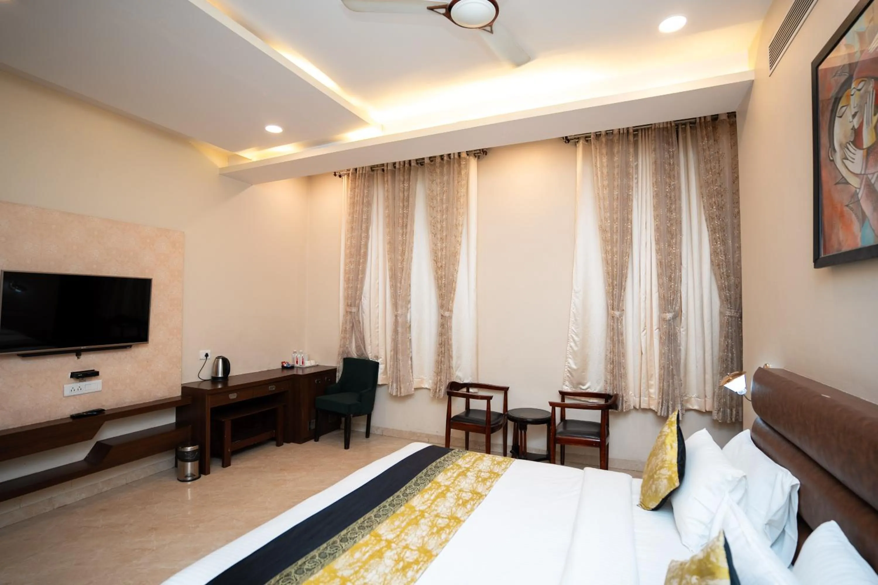 Bed in Hotel Radiance Courtyard