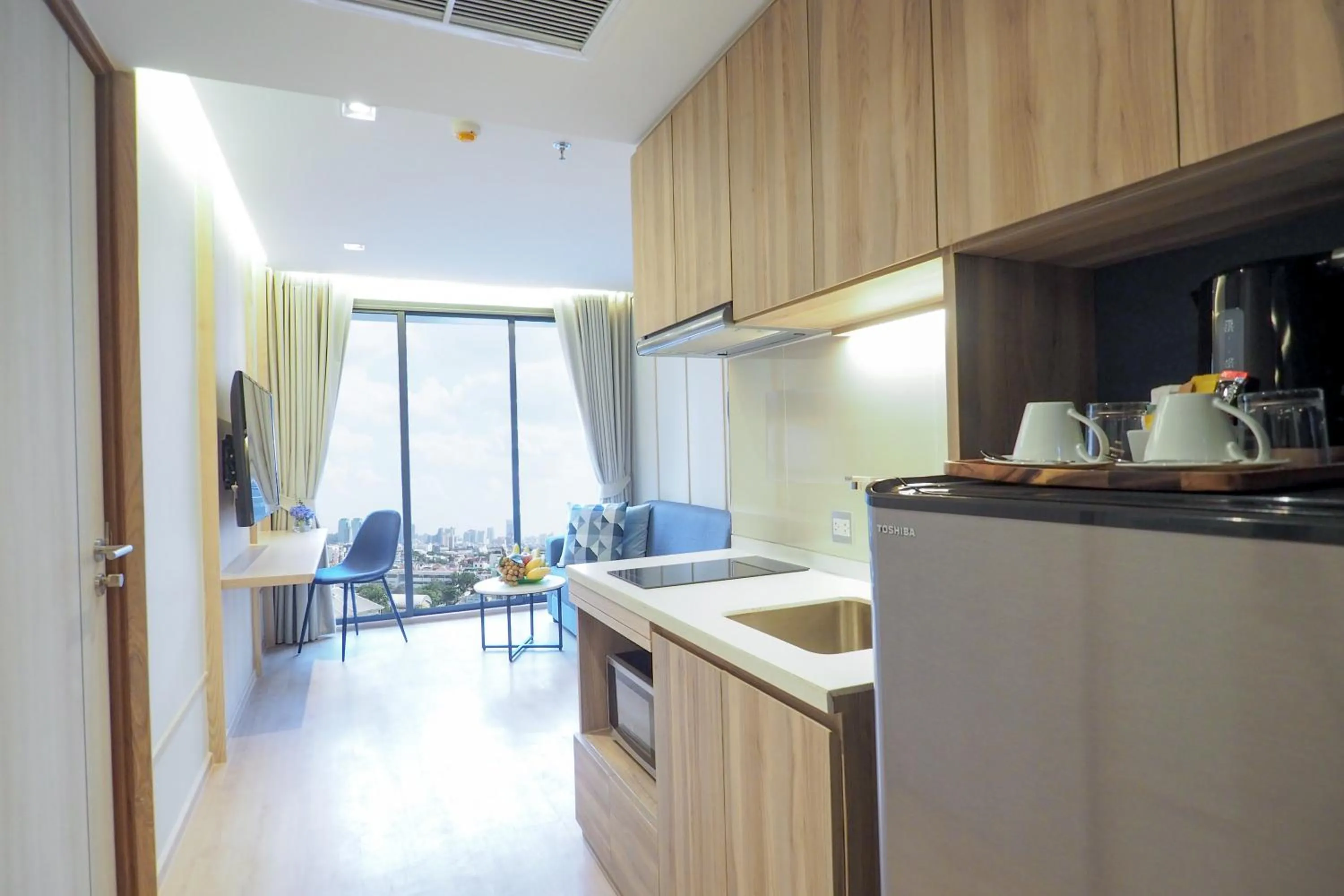 Kitchen or kitchenette in The Quarter Phromphong by UHG