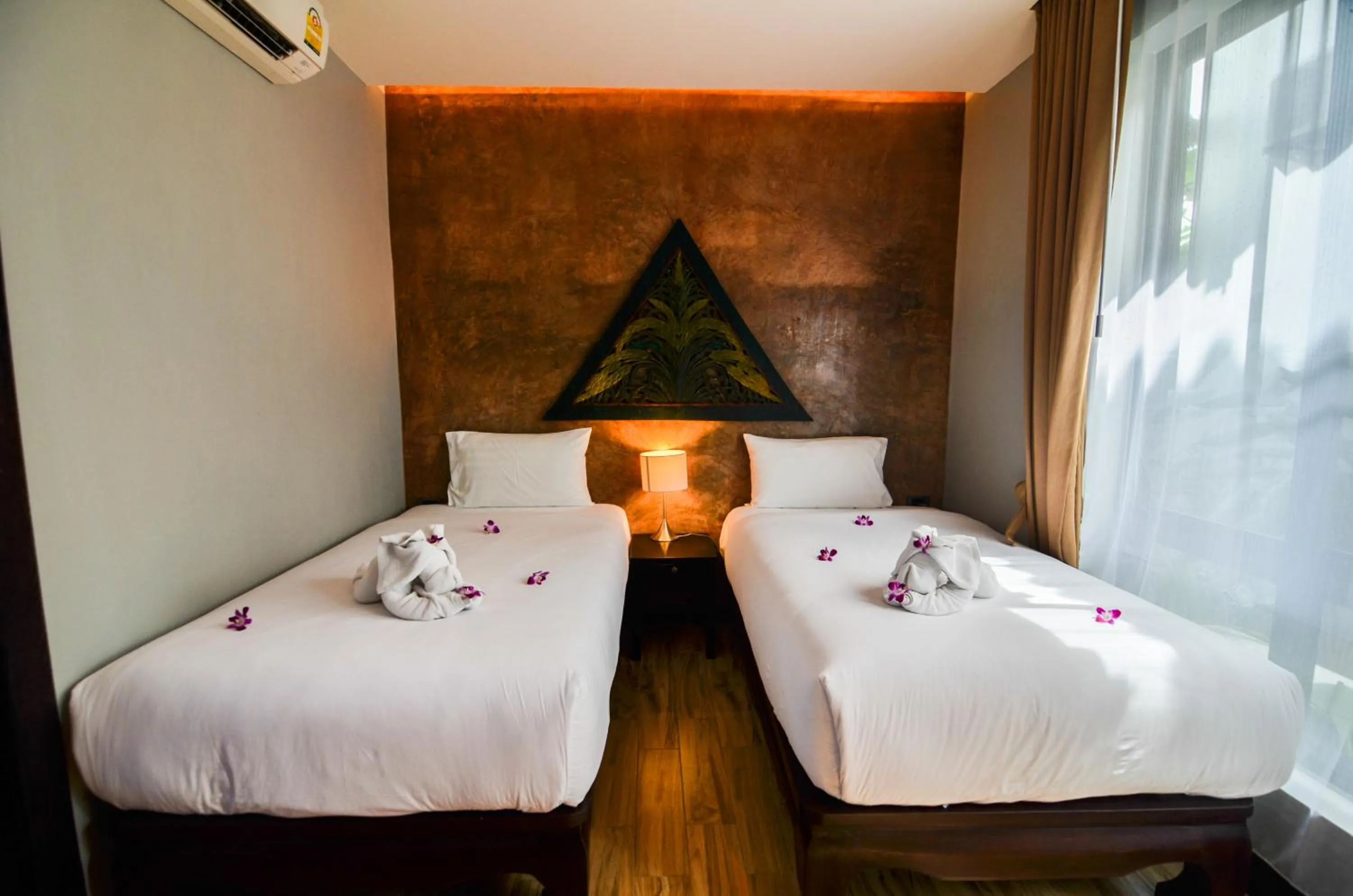 Bed in Coco Paradiso Phuket SHA