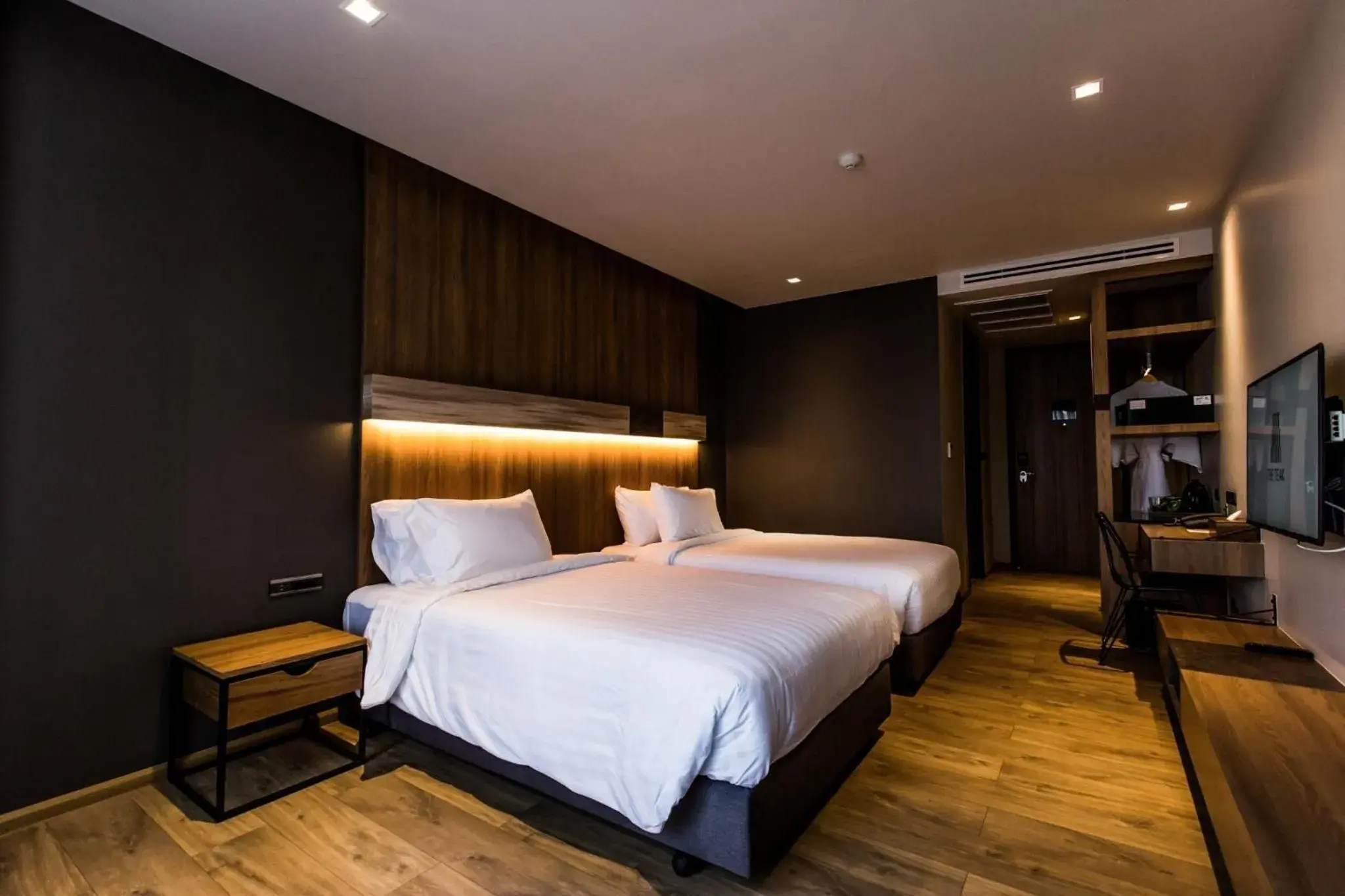 Bed in The Teak Hotel Bed in The Teak Hotel