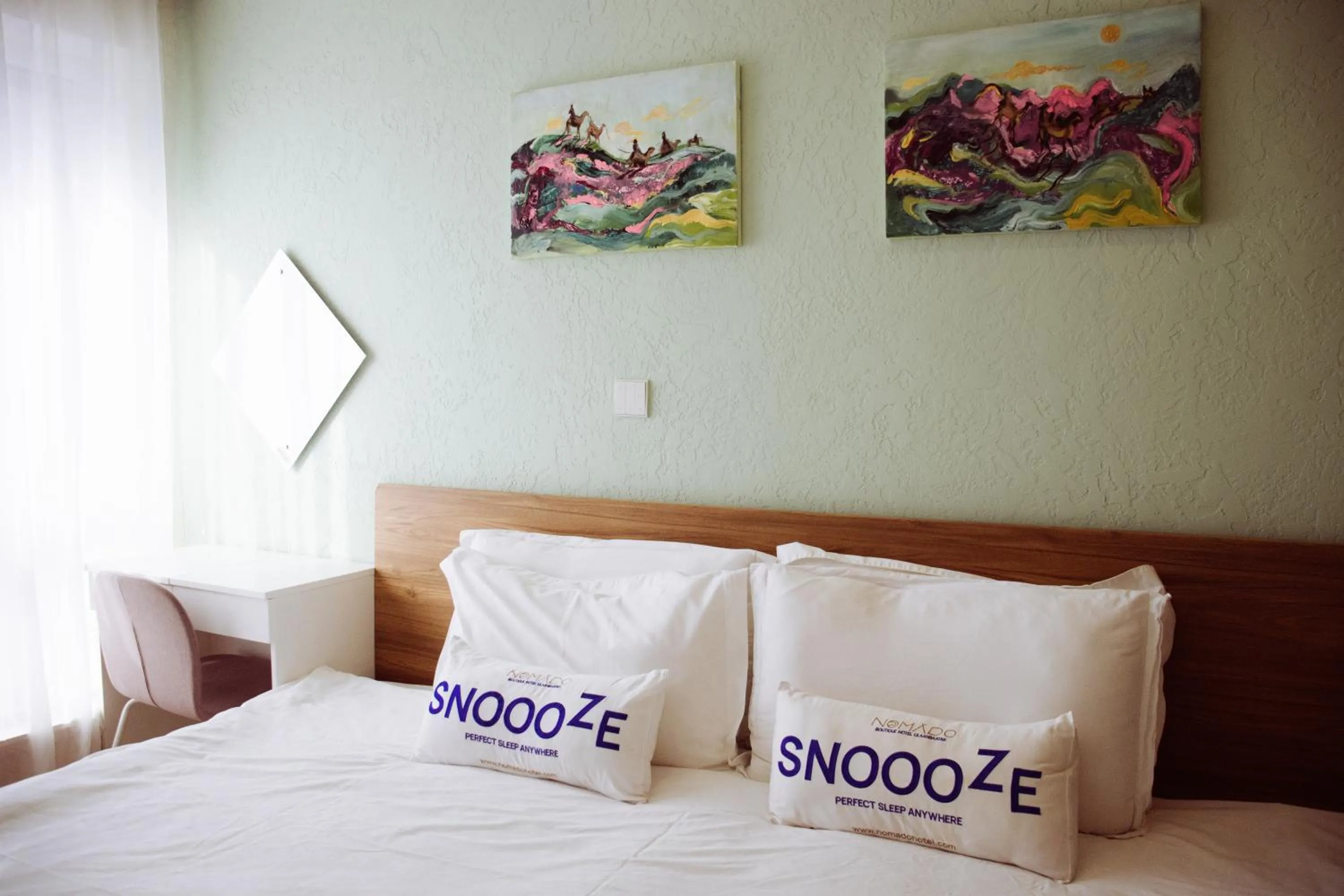 Bed in Nomado Boutique Hotel