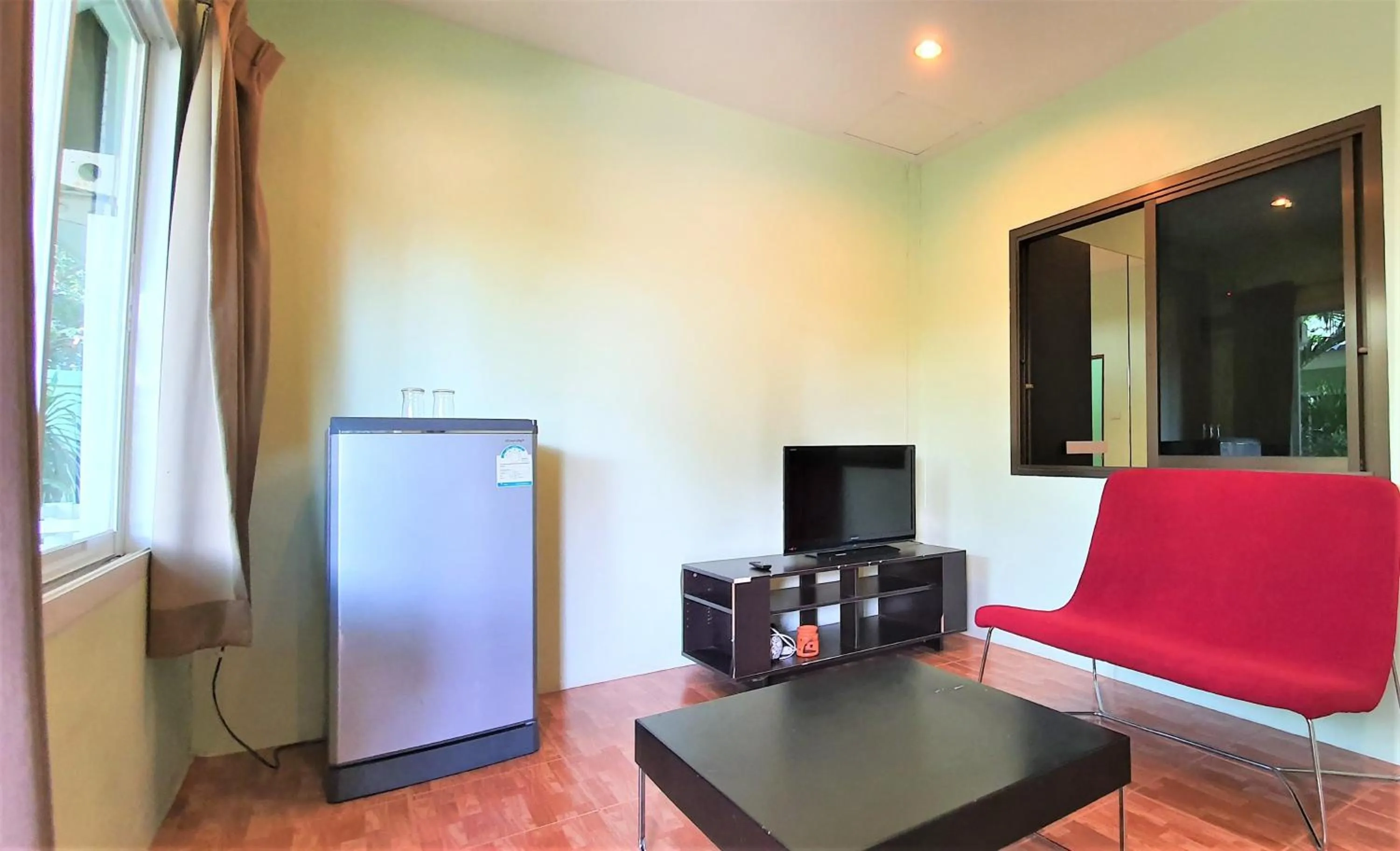 TV and multimedia in Chalong Stay Well by Palai Seafood