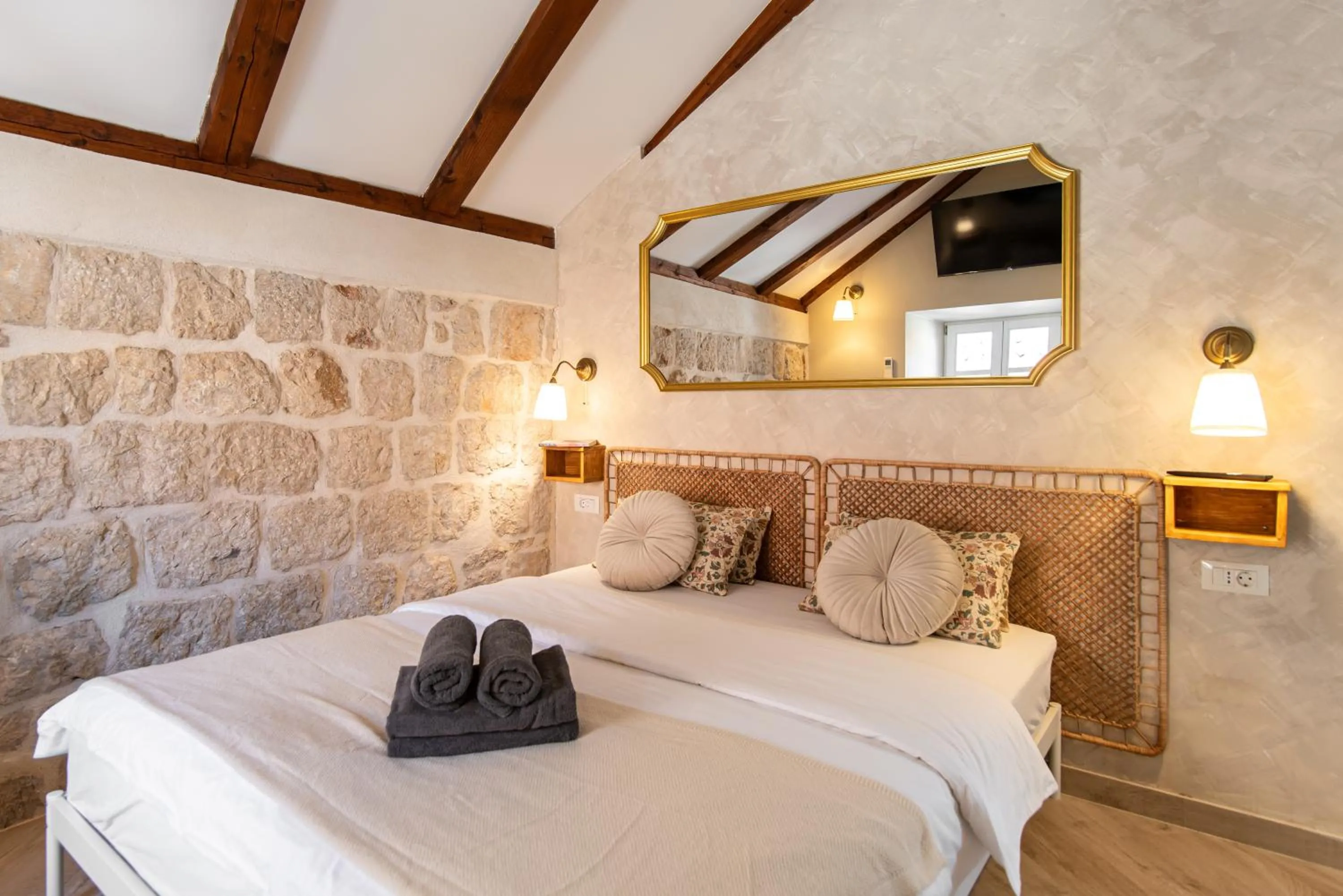 Bed in Ragusa City Walls Apartments
