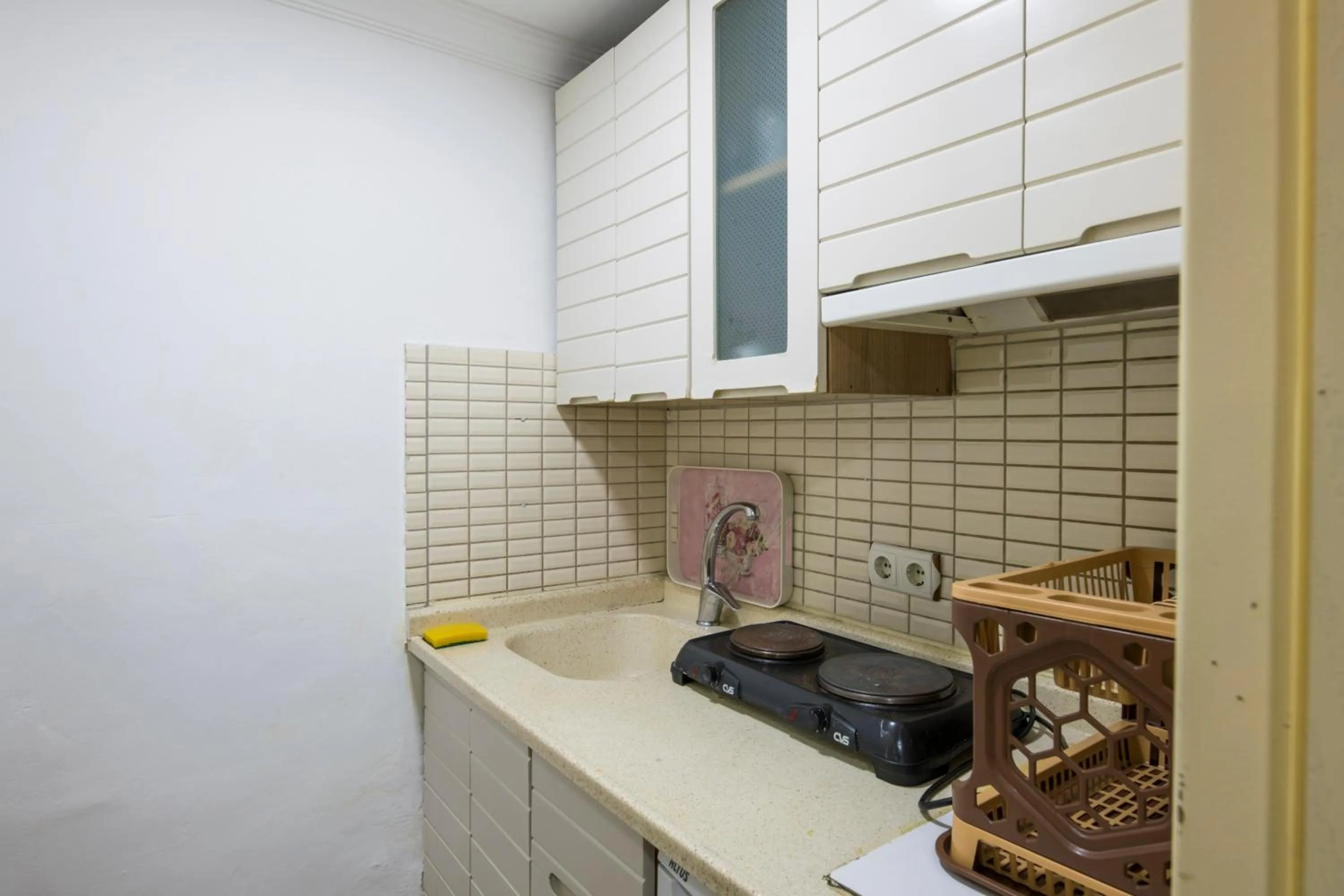 Kitchen or kitchenette in Punto Suite