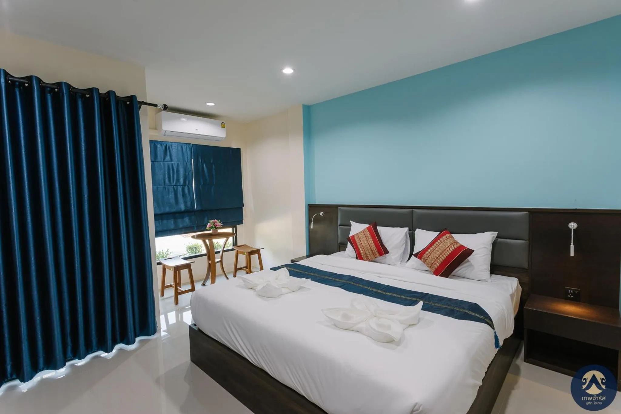 Bed in Thepchamrat Boutique Hotel