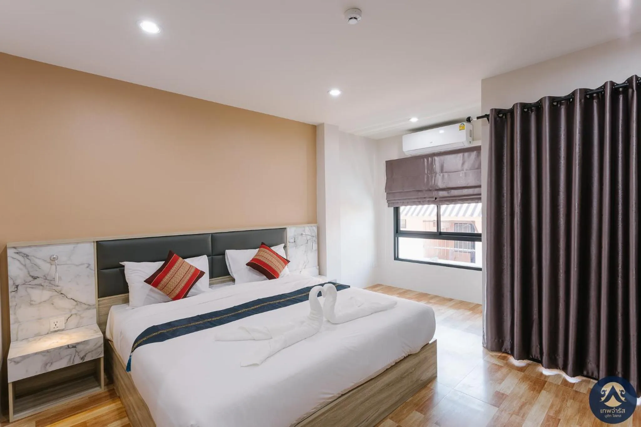 Bed in Thepchamrat Boutique Hotel