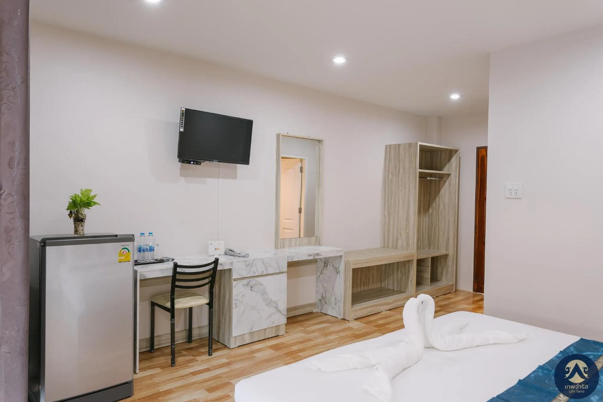 Bed in Thepchamrat Boutique Hotel