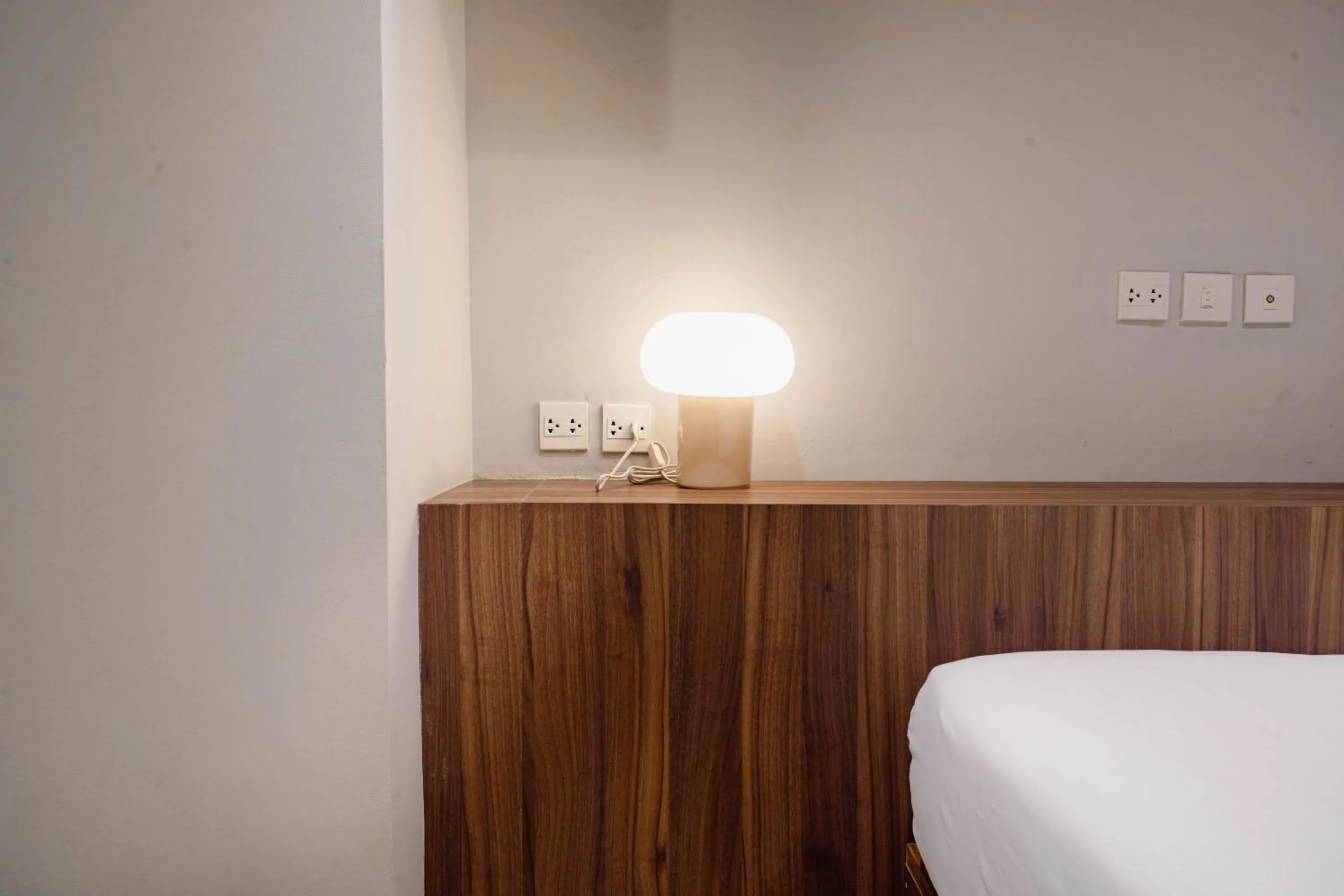 Bed in Woodstory Boutique Hotel