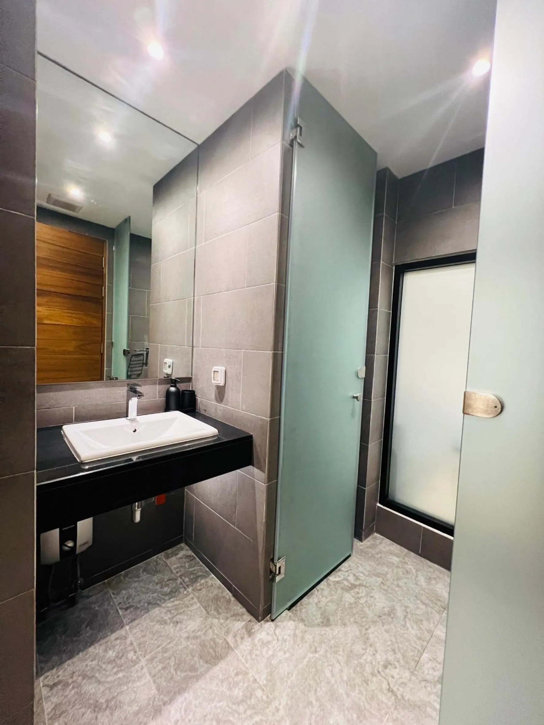 Shower in Woodstory Boutique Hotel