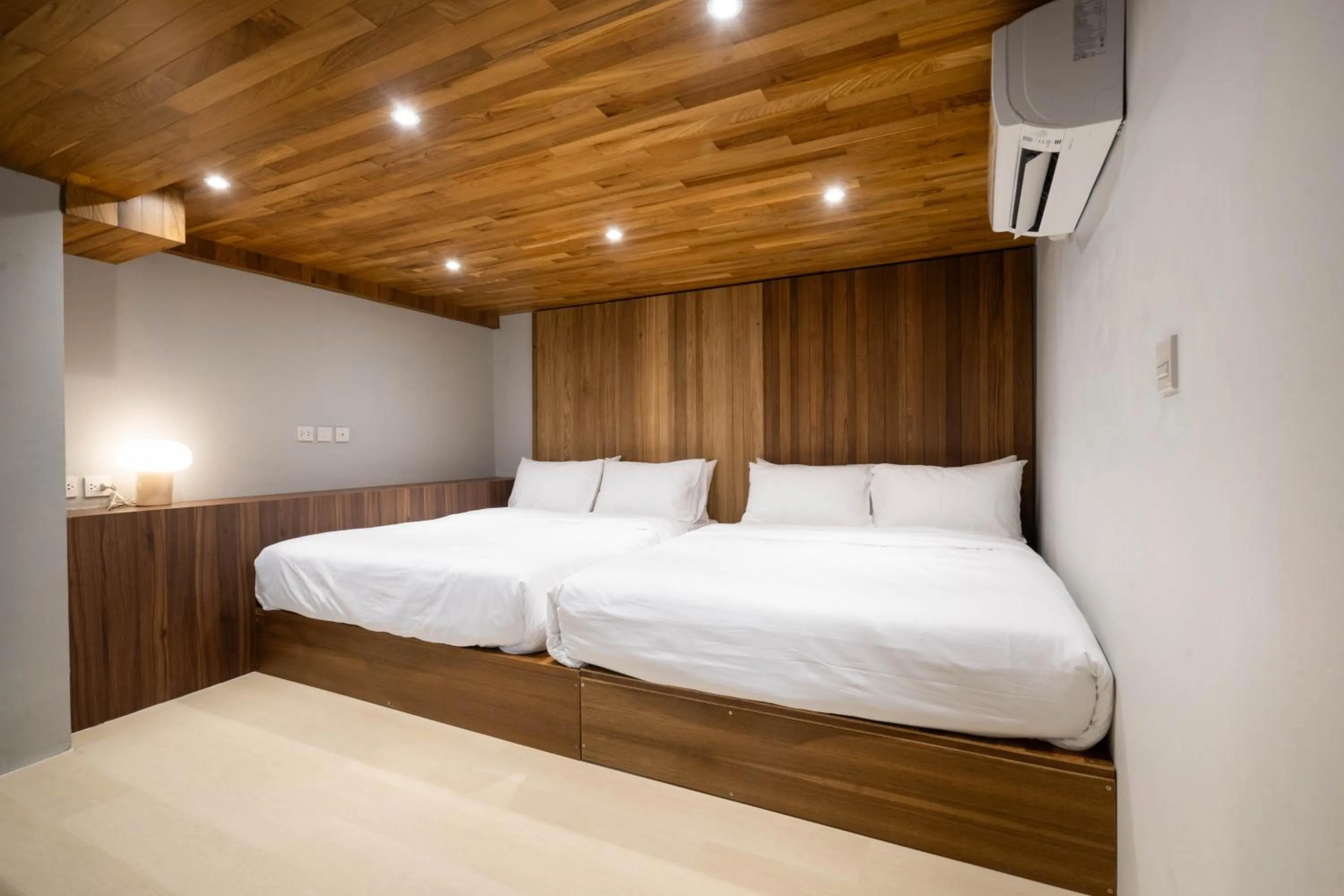 Bed in Woodstory Boutique Hotel