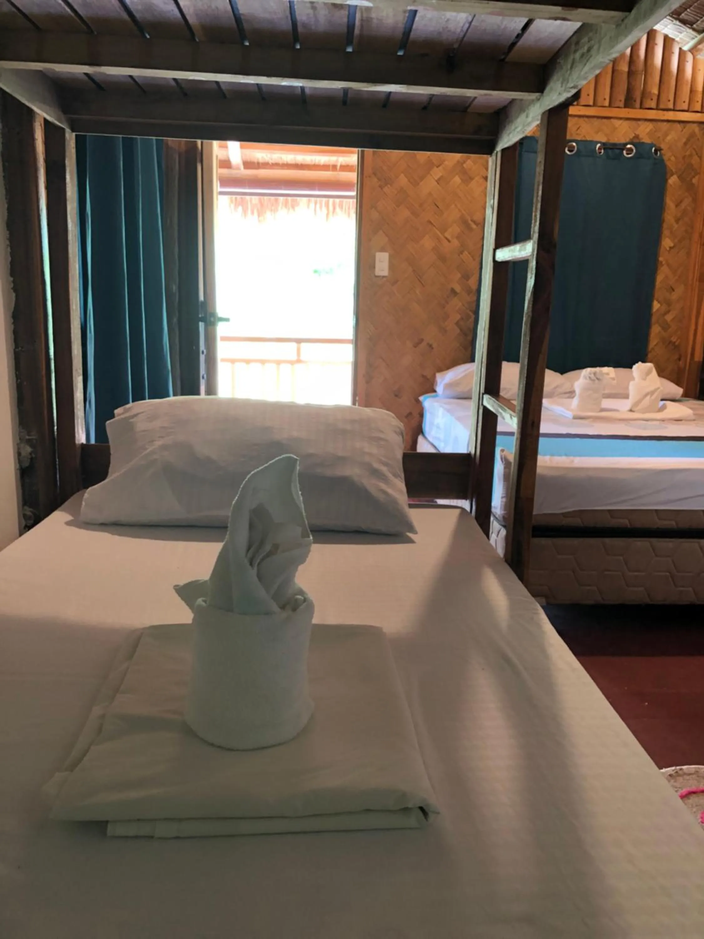 Bed in Zhaya's Beach & Cottages