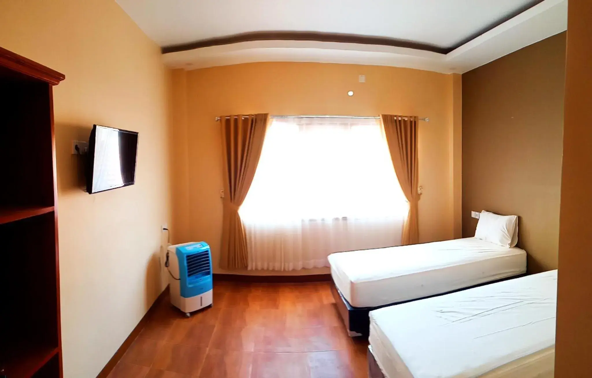 Deluxe Twin Room in Bluefire Homestay Syariah Deluxe Twin Room in Bluefire Homestay Syariah