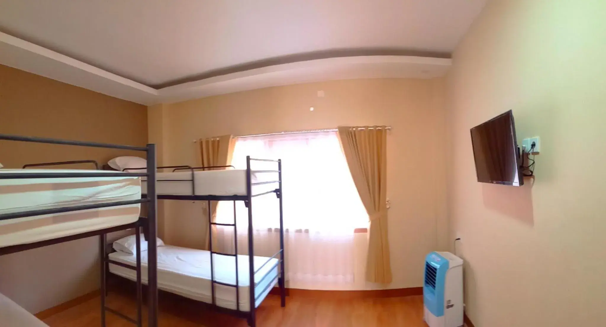 Bed in 4-Bed Male Dormitory Room in Bluefire Homestay Syariah Bed in 4-Bed Male Dormitory Room in Bluefire Homestay Syariah