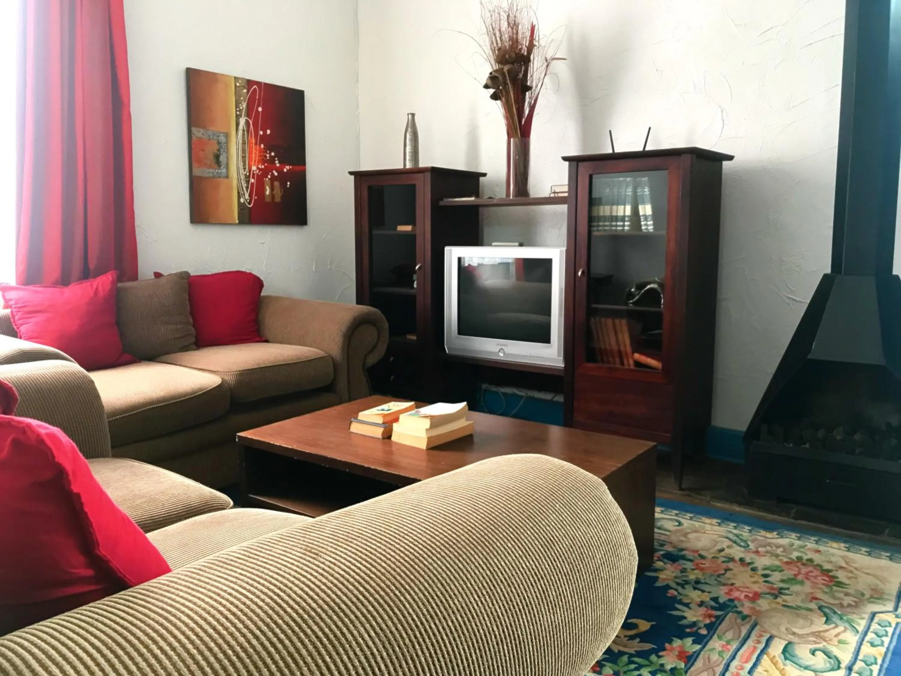 Communal lounge/ TV room in Athenian Villa