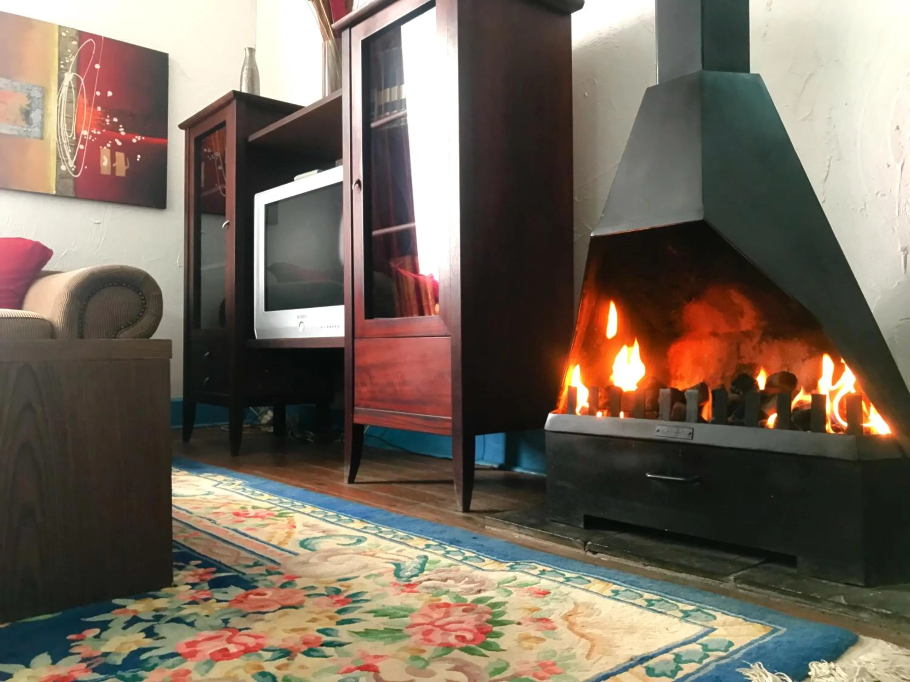 Communal lounge/ TV room in Athenian Villa