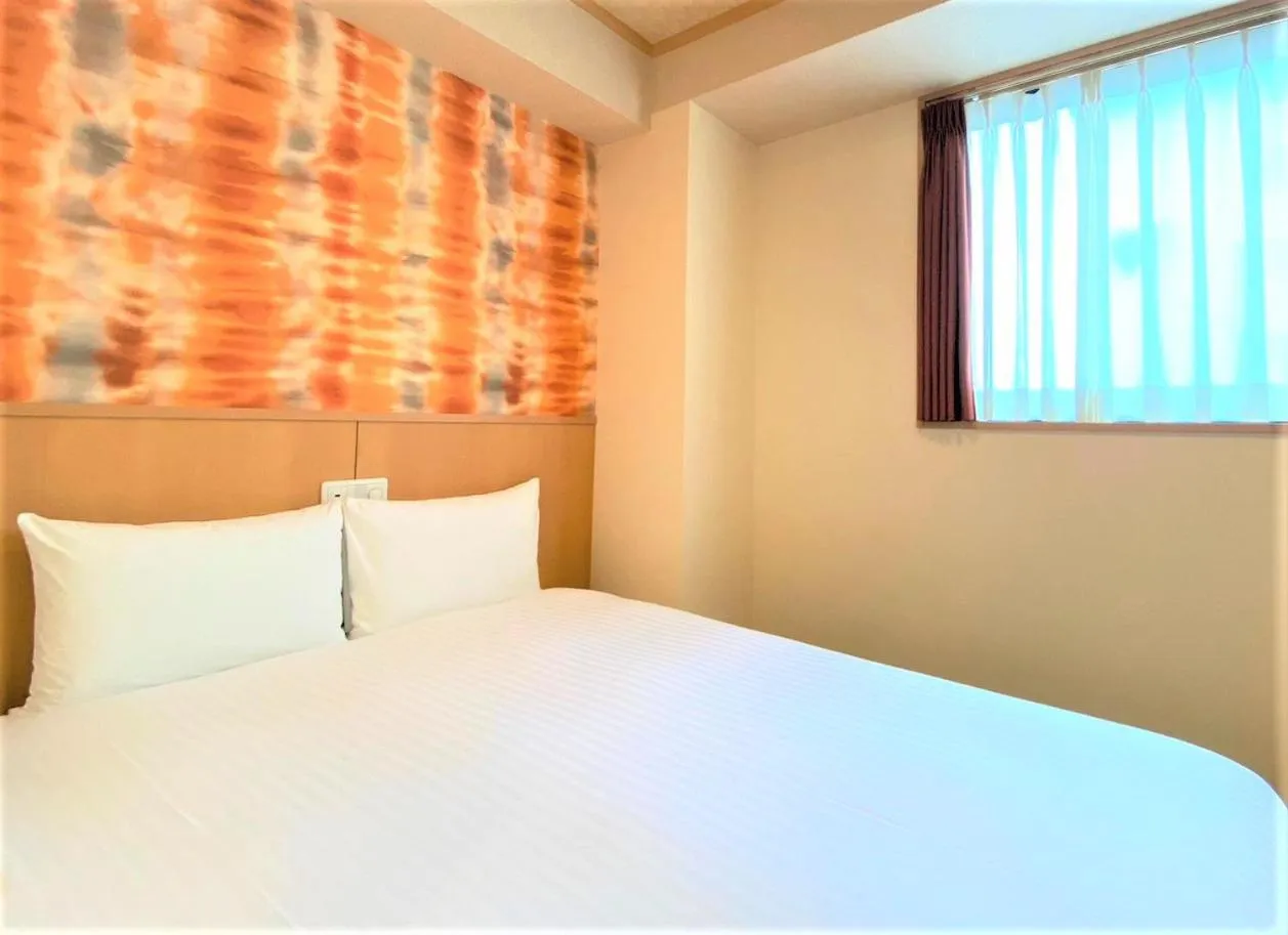 Bed in SAKURA SKY HOTEL KASHIWA(桜スカイホテル柏)