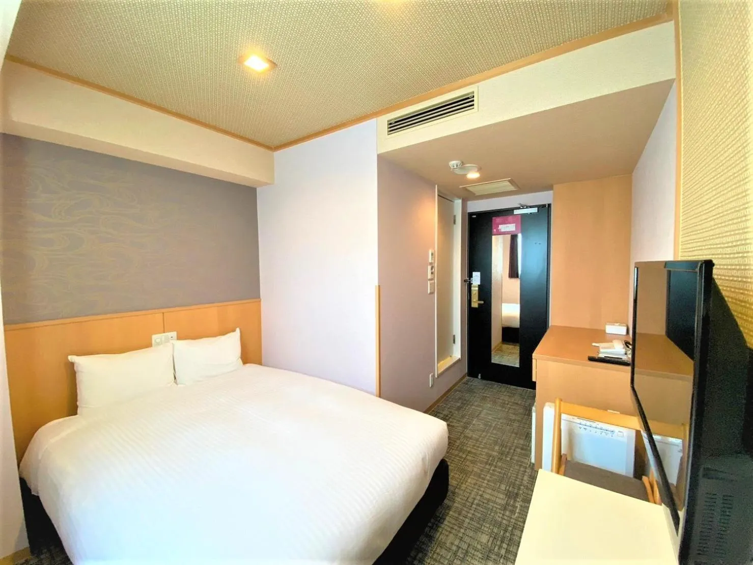 Bed in SAKURA SKY HOTEL KASHIWA(桜スカイホテル柏)